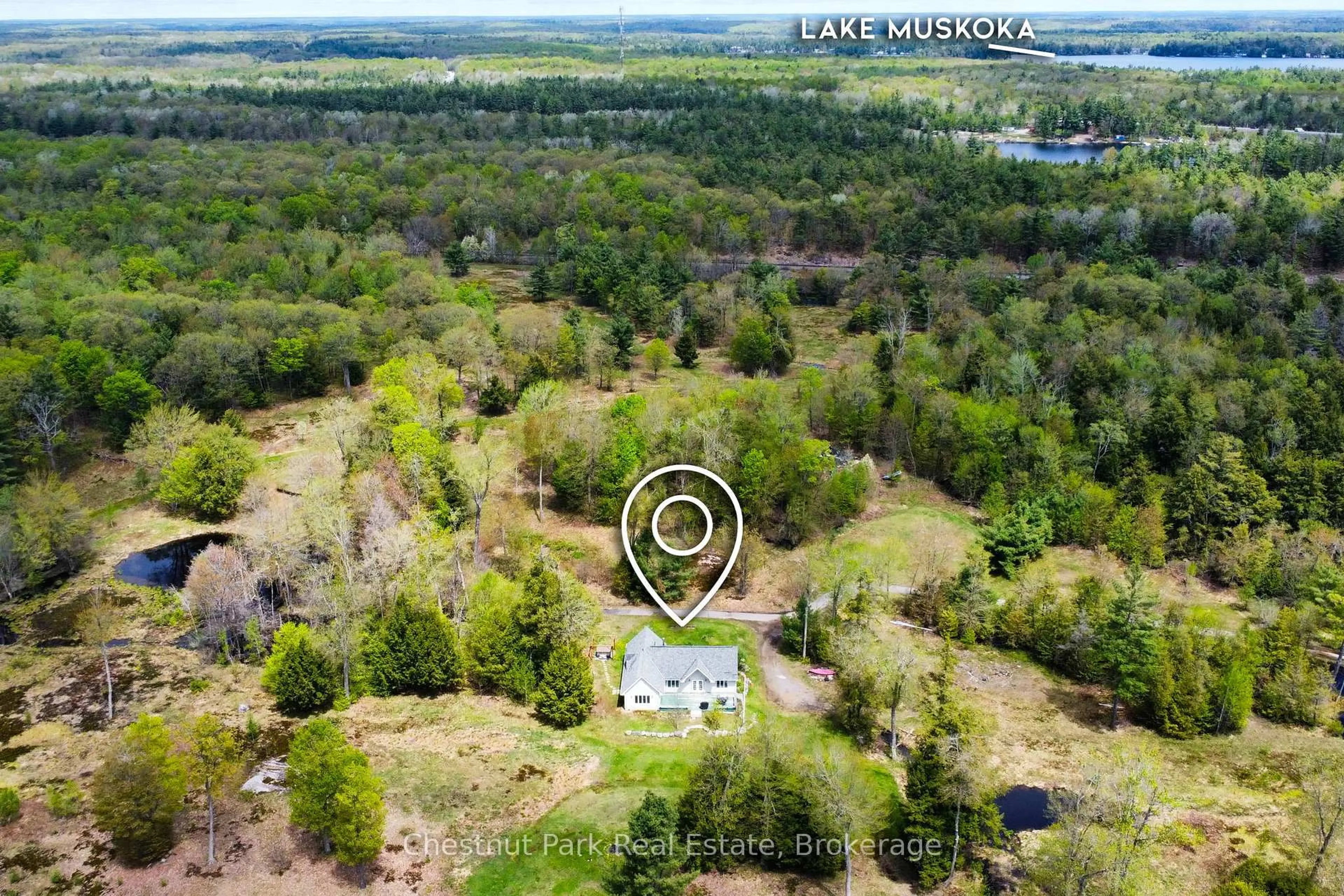 A pic from outside/outdoor area/front of a property/back of a property/a pic from drone, forest/trees view for 1100 Moon River Rd, Muskoka Lakes Ontario P0C 1A0