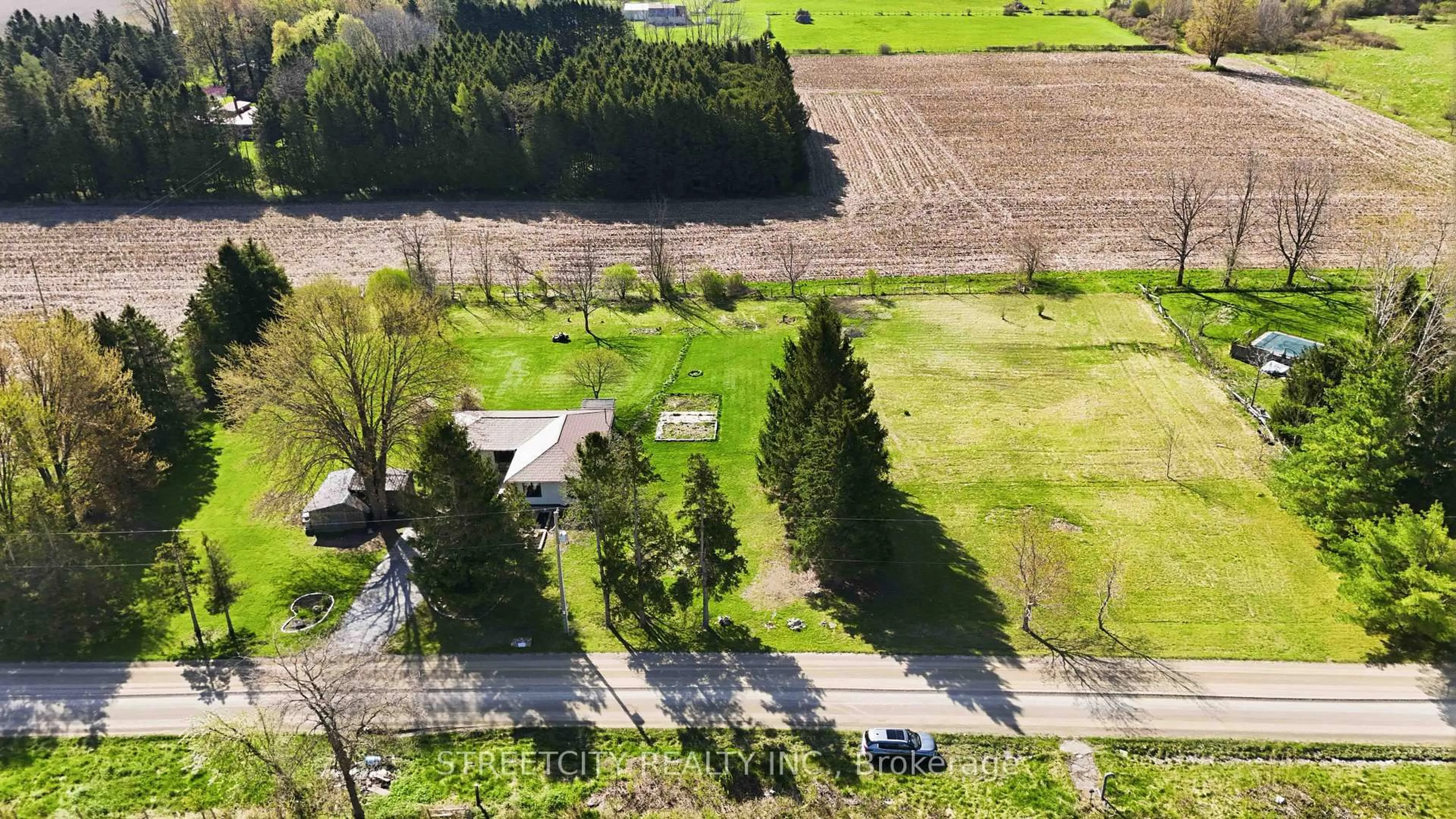 A pic from outside/outdoor area/front of a property/back of a property/a pic from drone, street for 10867 Melrose Dr, Middlesex Centre Ontario N0L 1R0