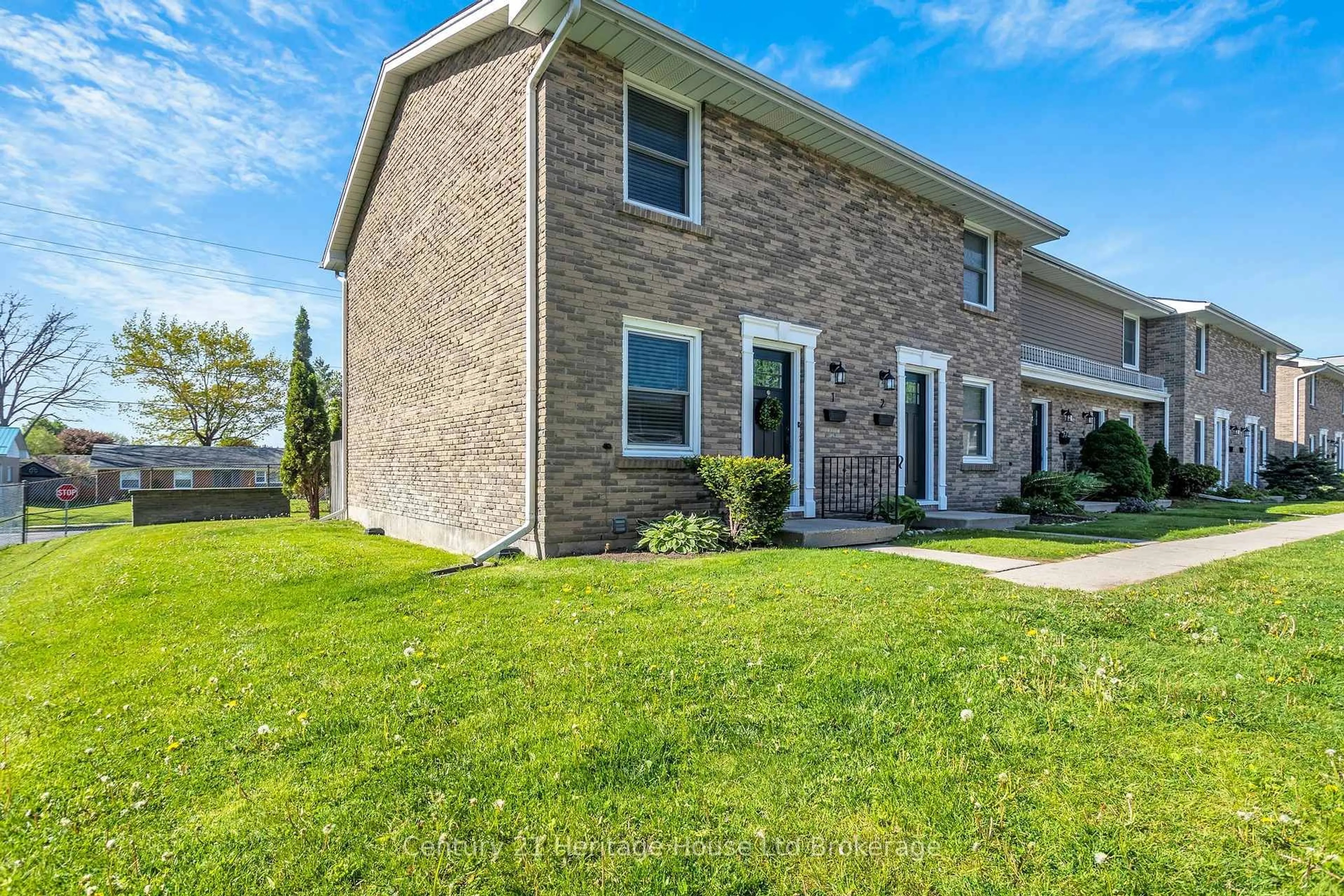 Home with vinyl exterior material, street for 144 Concession St #1, Tillsonburg Ontario N4G 1N5