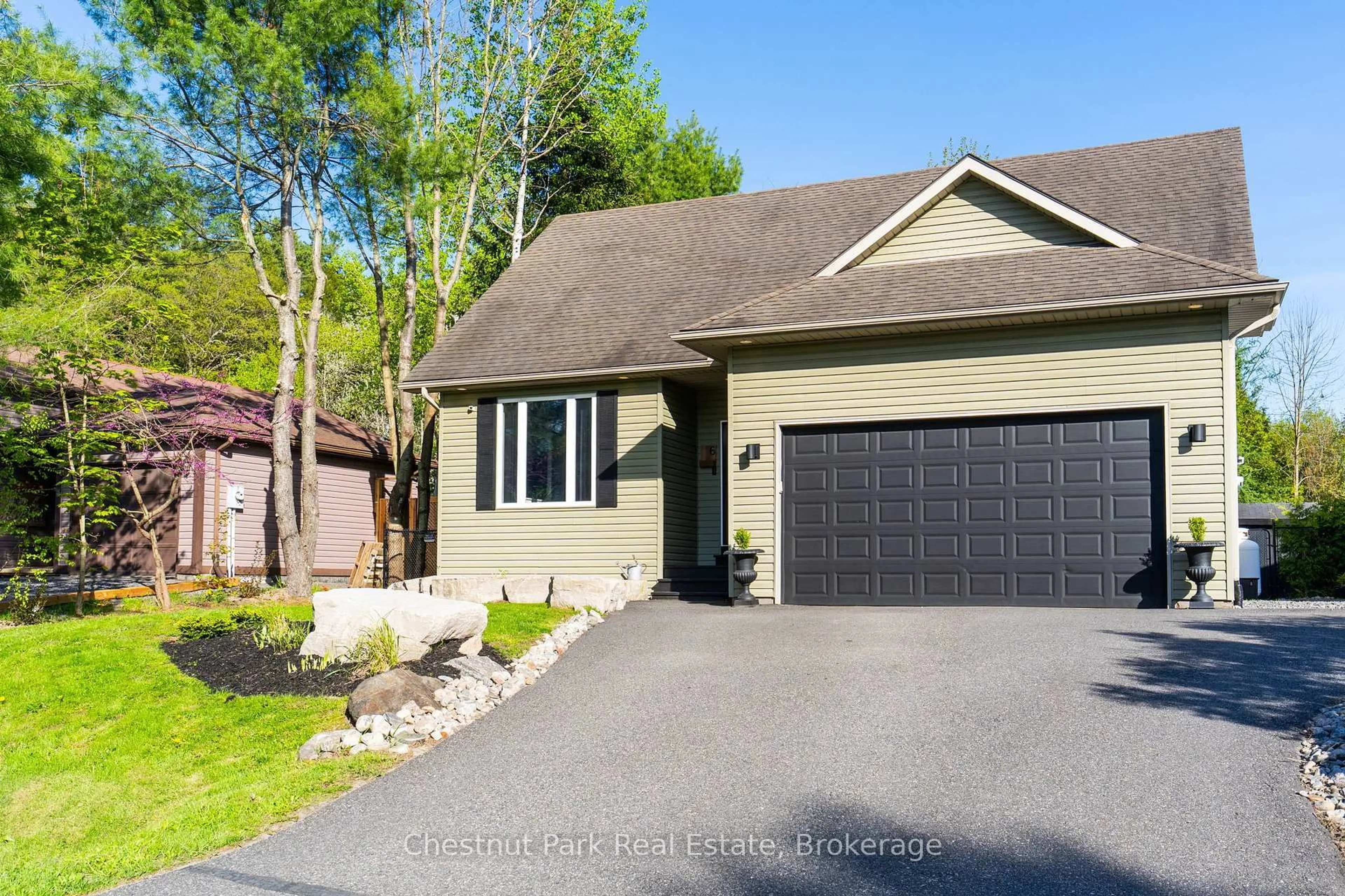 Home with vinyl exterior material, street for 6 Johnston St, Muskoka Lakes Ontario P0B 1J0