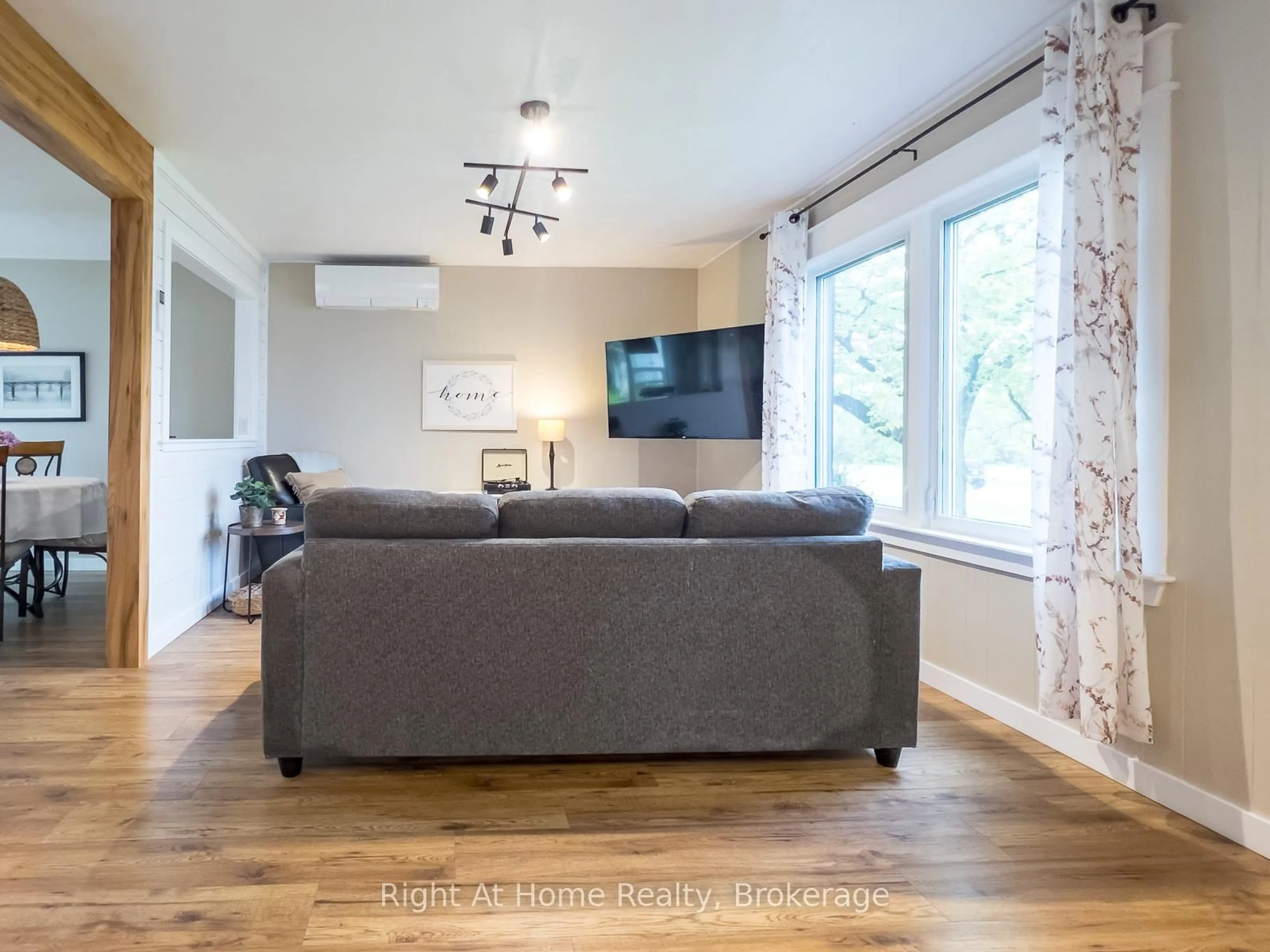 Living room with furniture, wood/laminate floor for 169 North St, Stirling Ontario K0K 3E0