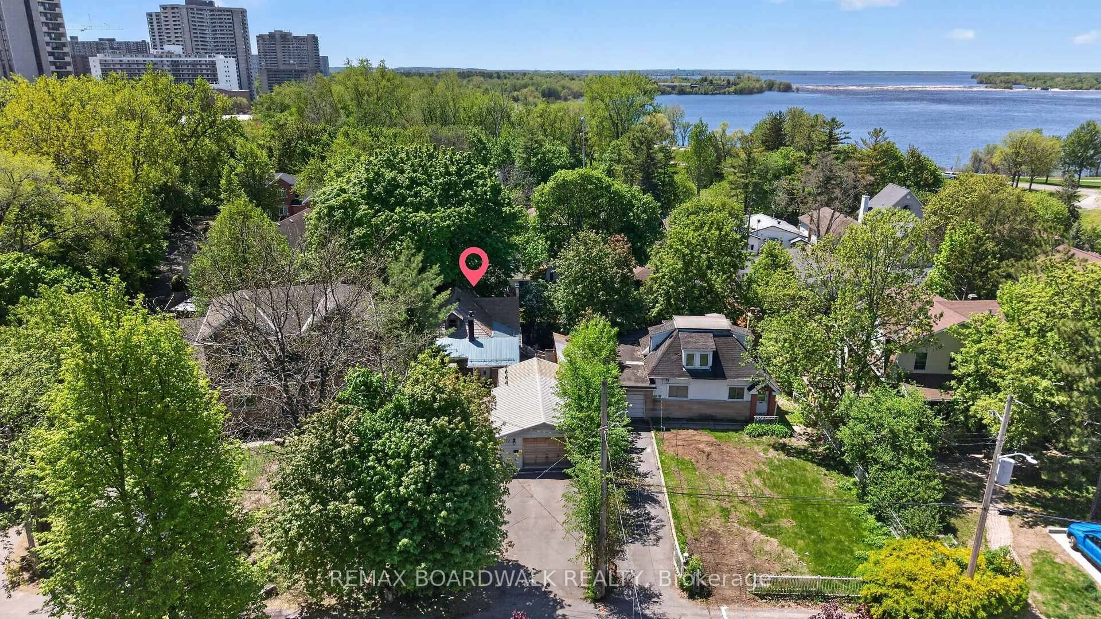 A pic from outside/outdoor area/front of a property/back of a property/a pic from drone, water/lake/river/ocean view for 92 Orvigale Rd, Ottawa Ontario K2B 5A2