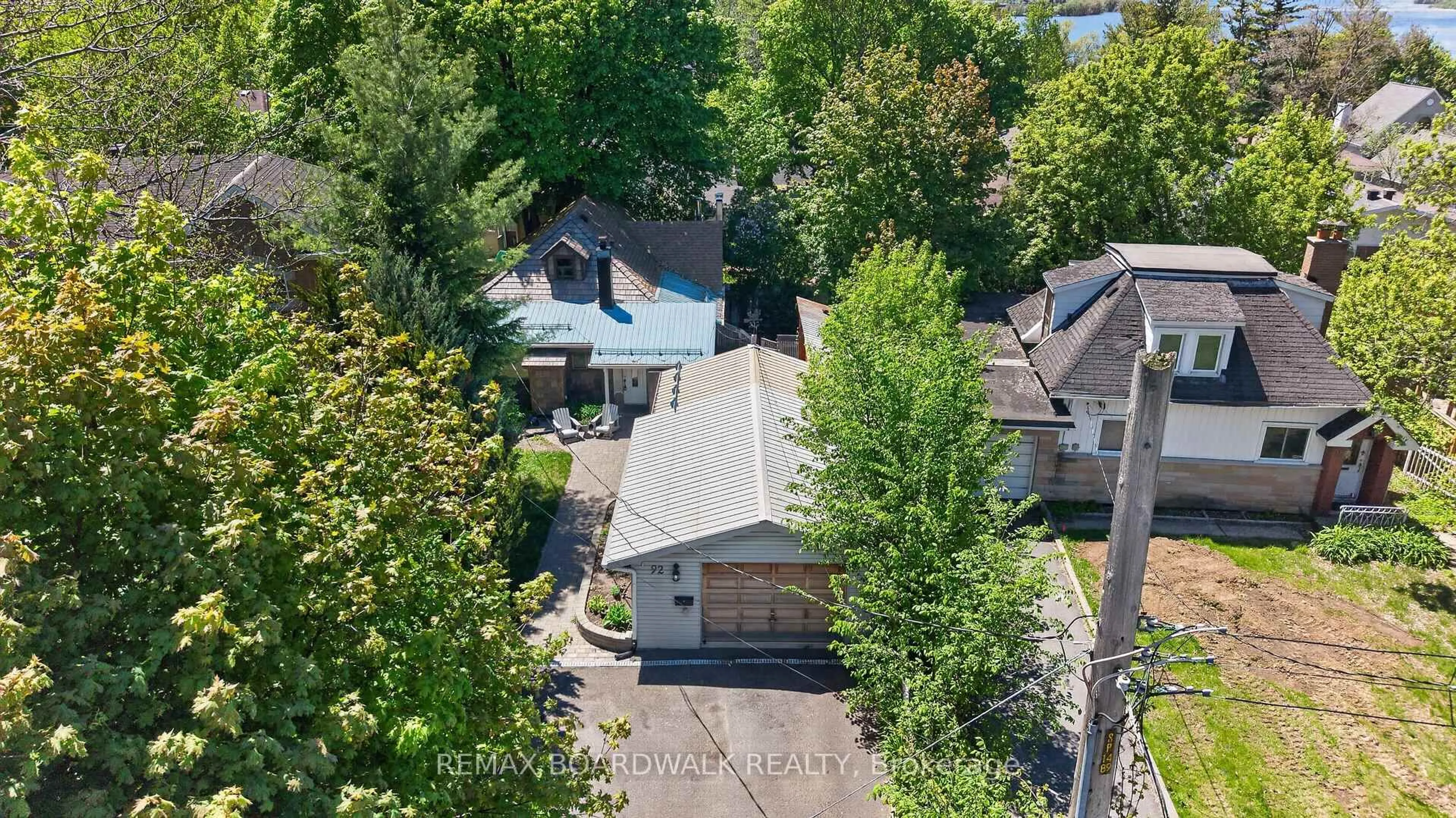 A pic from outside/outdoor area/front of a property/back of a property/a pic from drone, street for 92 Orvigale Rd, Ottawa Ontario K2B 5A2