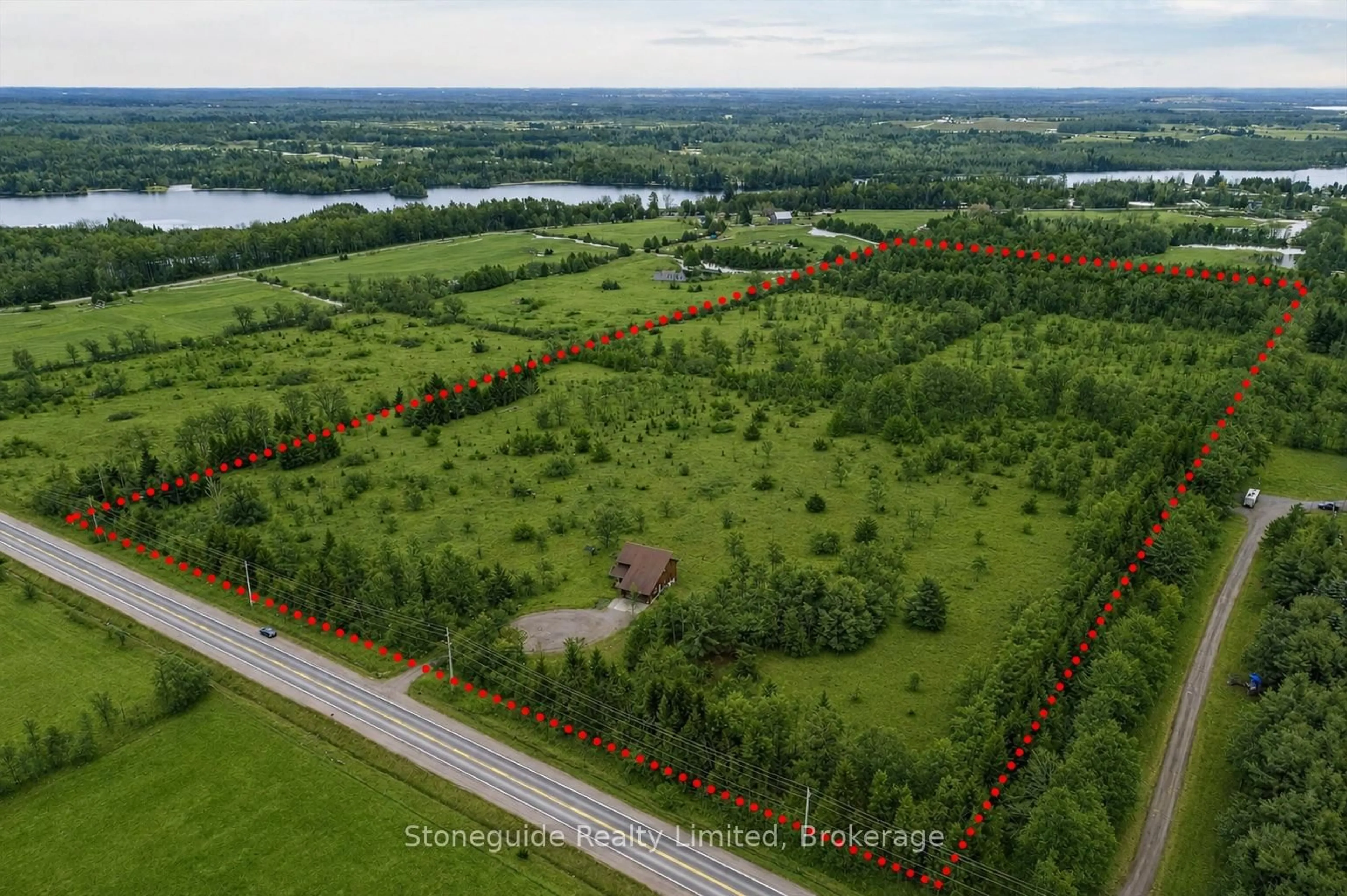 A pic from outside/outdoor area/front of a property/back of a property/a pic from drone, water/lake/river/ocean view for 2509 12th Line, Selwyn Ontario K0L 2H0