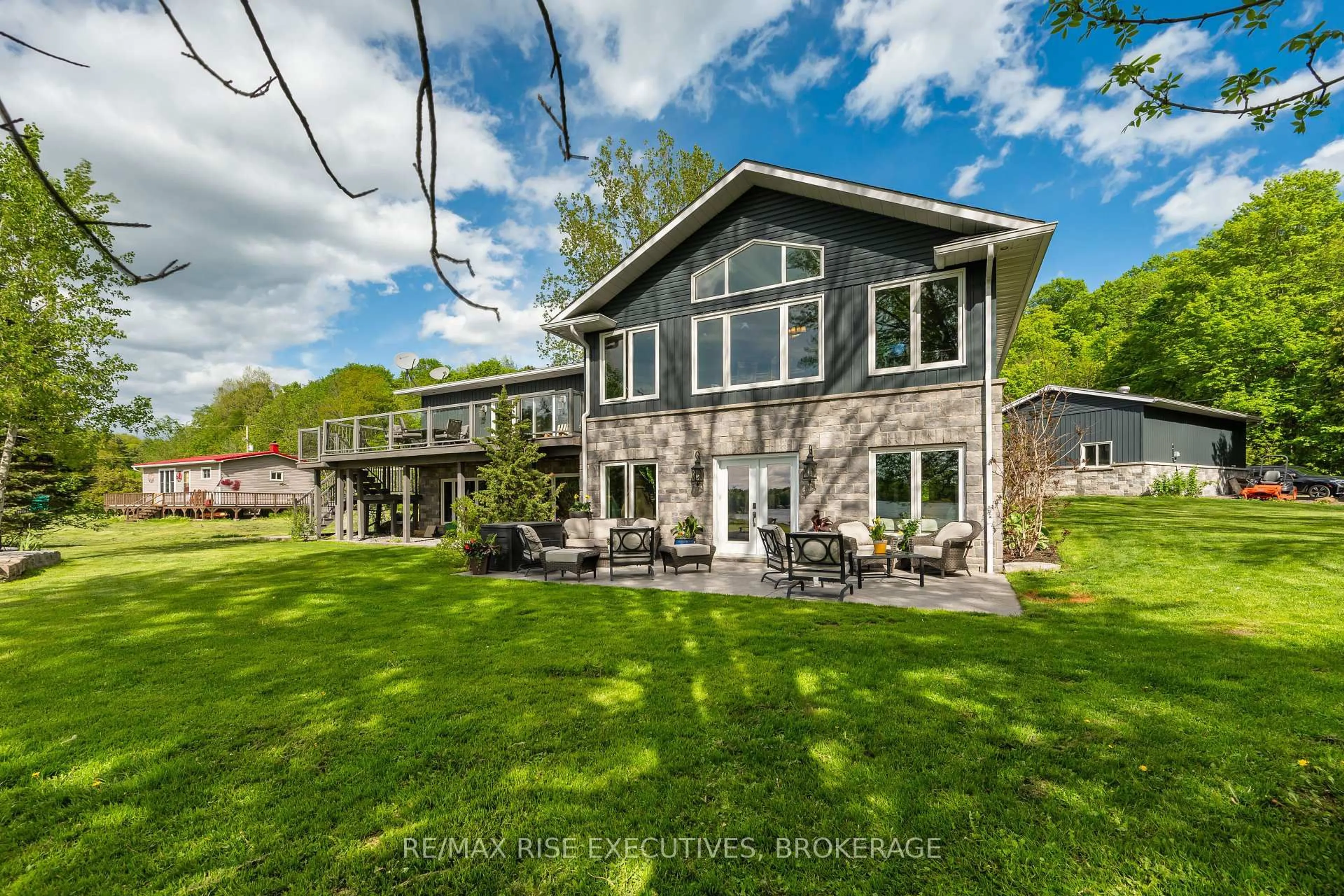 A pic from outside/outdoor area/front of a property/back of a property/a pic from drone, water/lake/river/ocean view for 801 Camp Lane, Leeds and the Thousand Islands Ontario K0E 1N0