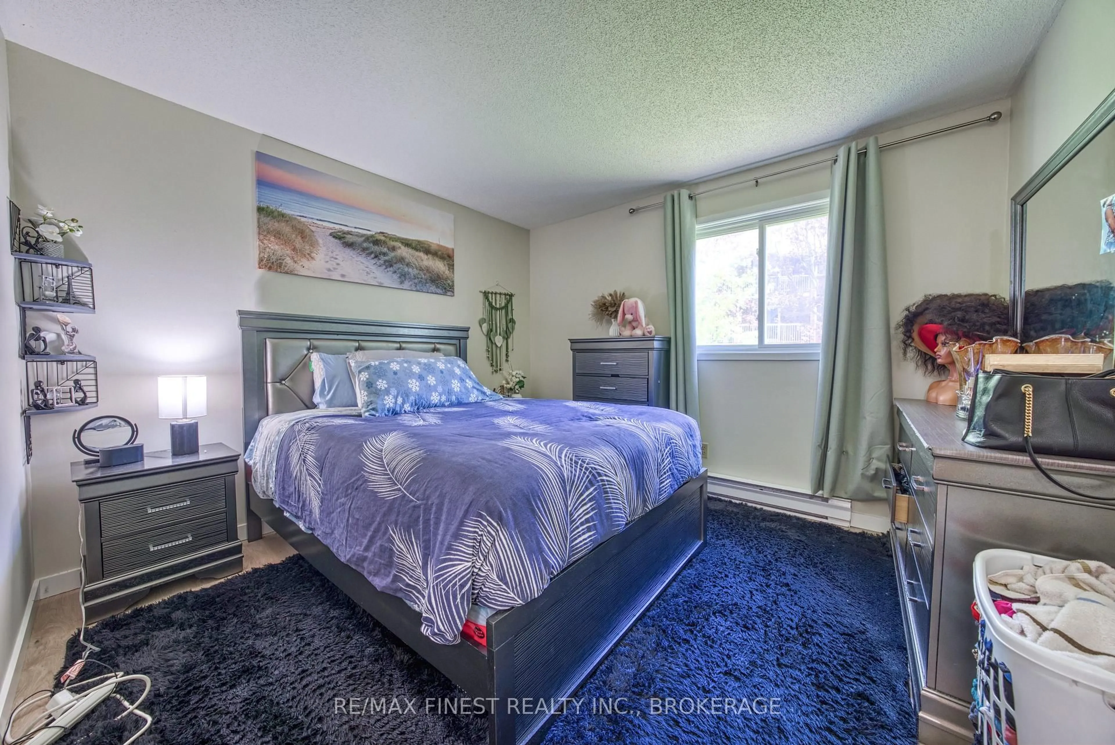 Bedroom with bed, carpet floor for 561 Armstrong Rd ##115, Kingston Ontario K7M 8J9