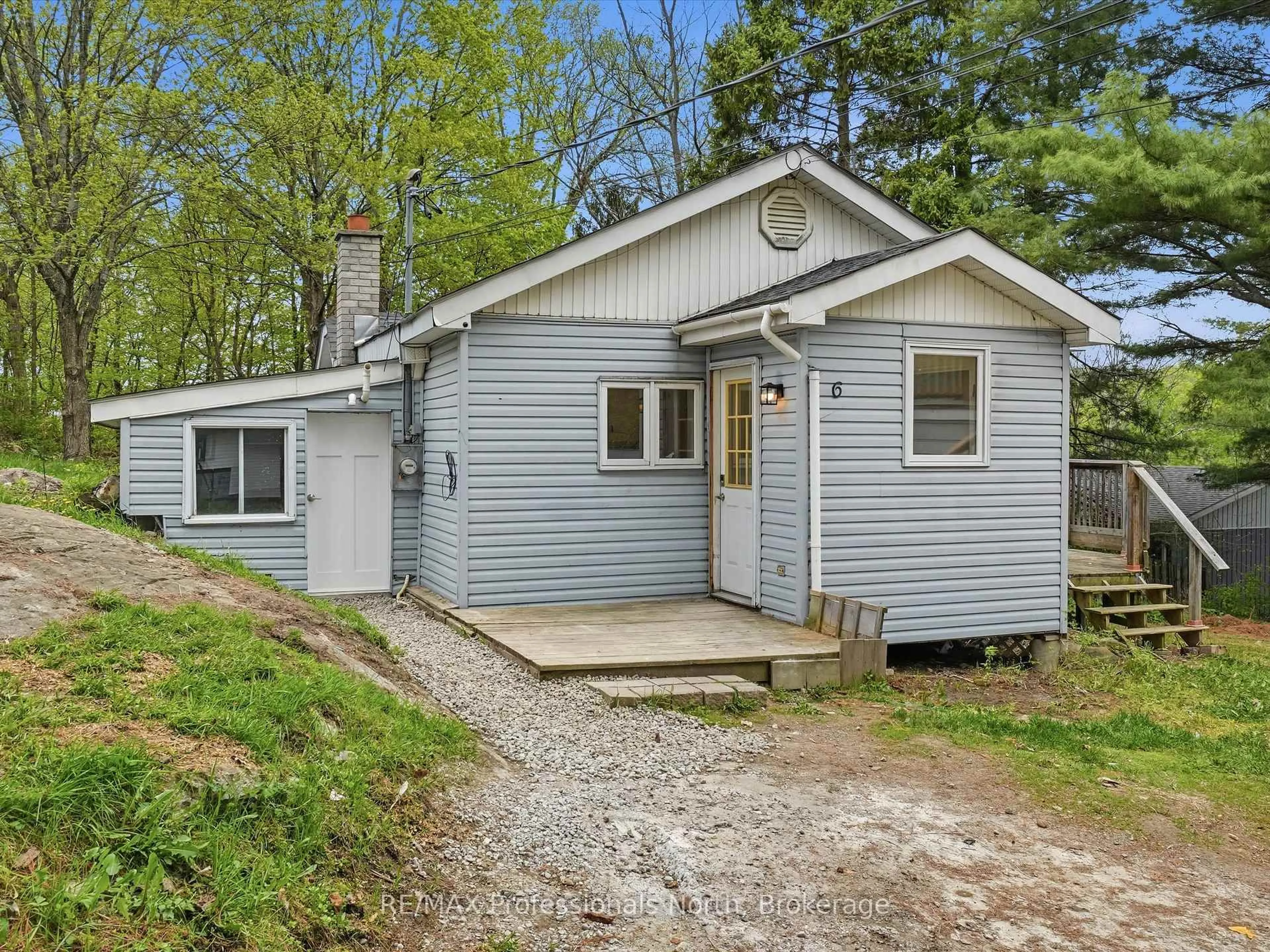 Home with vinyl exterior material, street for 6 Kitchen Rd, Huntsville Ontario P1H 1X9