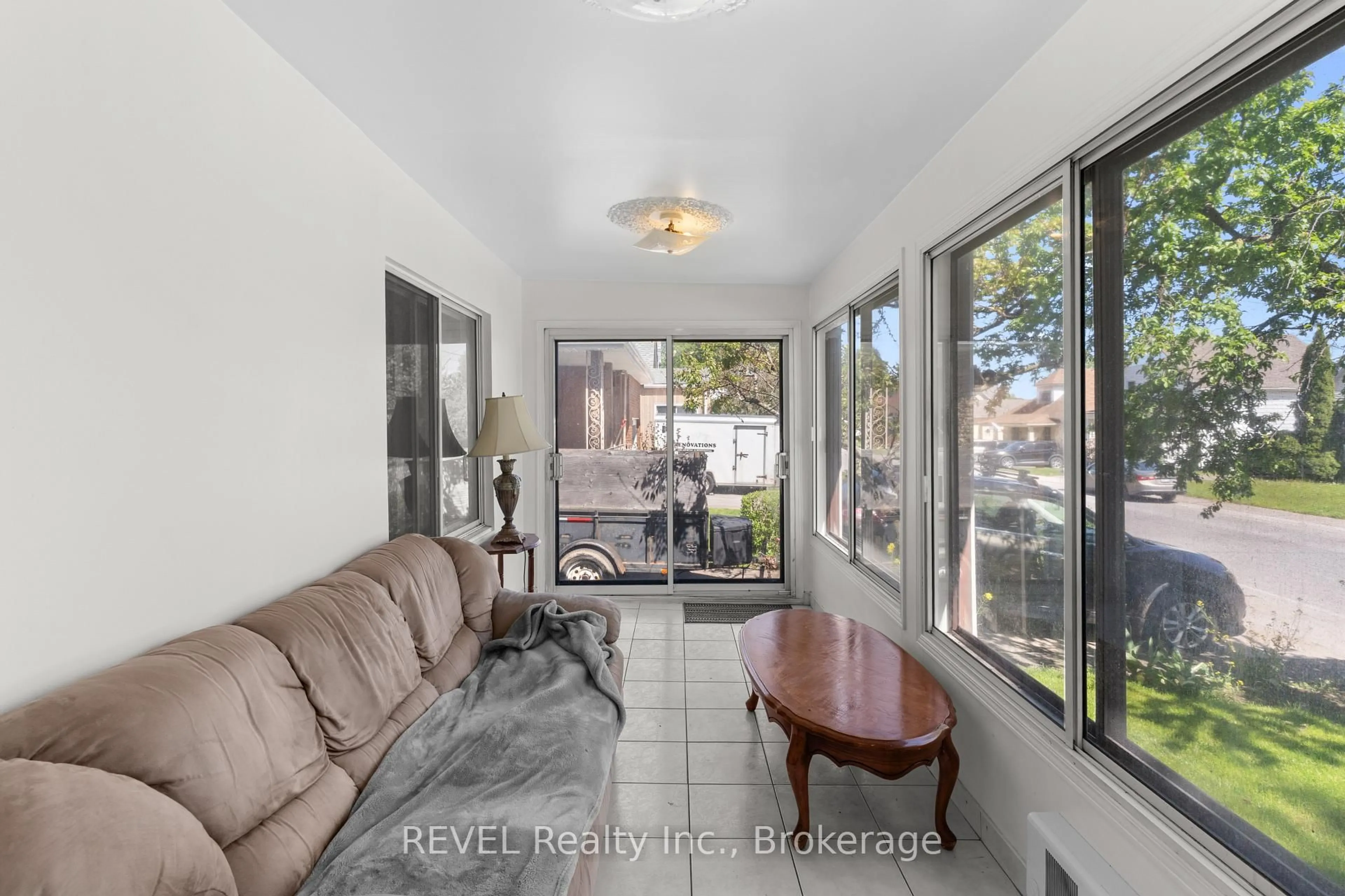 Living room with furniture, ceramic/tile floor for 6401 Taylor St, Niagara Falls Ontario L2G 2E9