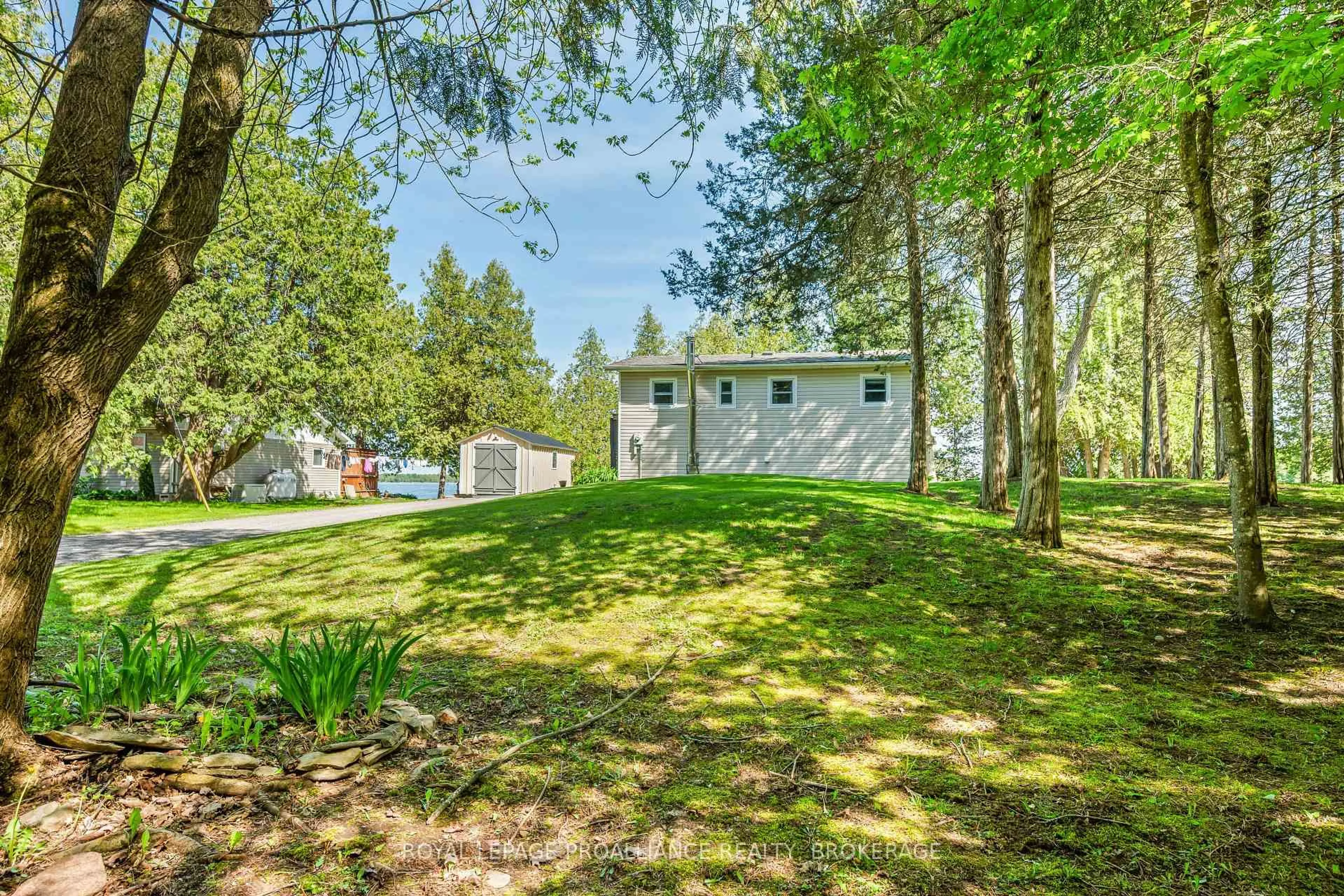 A pic from outside/outdoor area/front of a property/back of a property/a pic from drone, water/lake/river/ocean view for 180 Switzer Lane, Yarker Ontario K0K 3N0