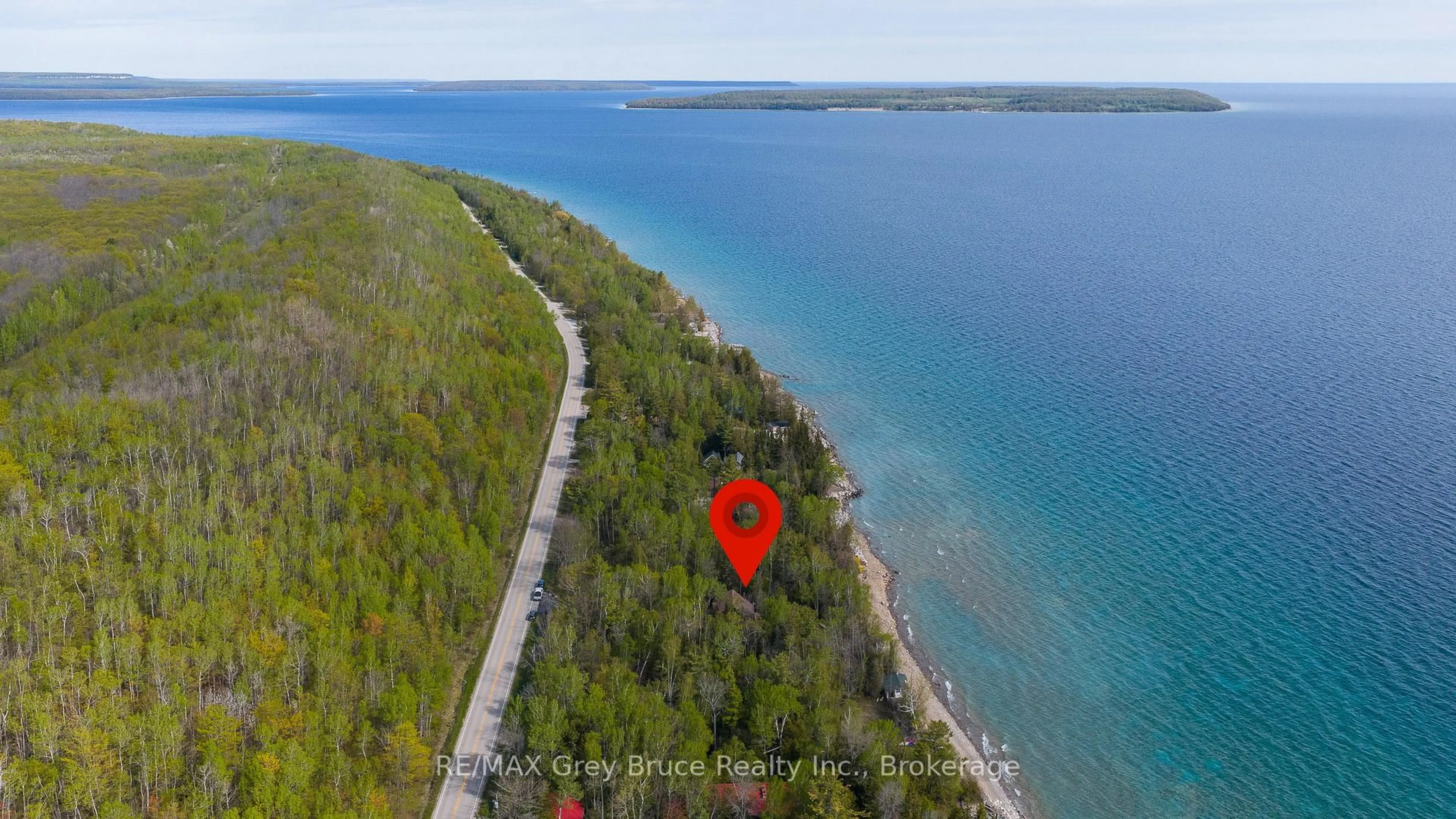 A pic from outside/outdoor area/front of a property/back of a property/a pic from drone, water/lake/river/ocean view for 504629 Grey Road 1, Georgian Bluffs Ontario N0H 2T0