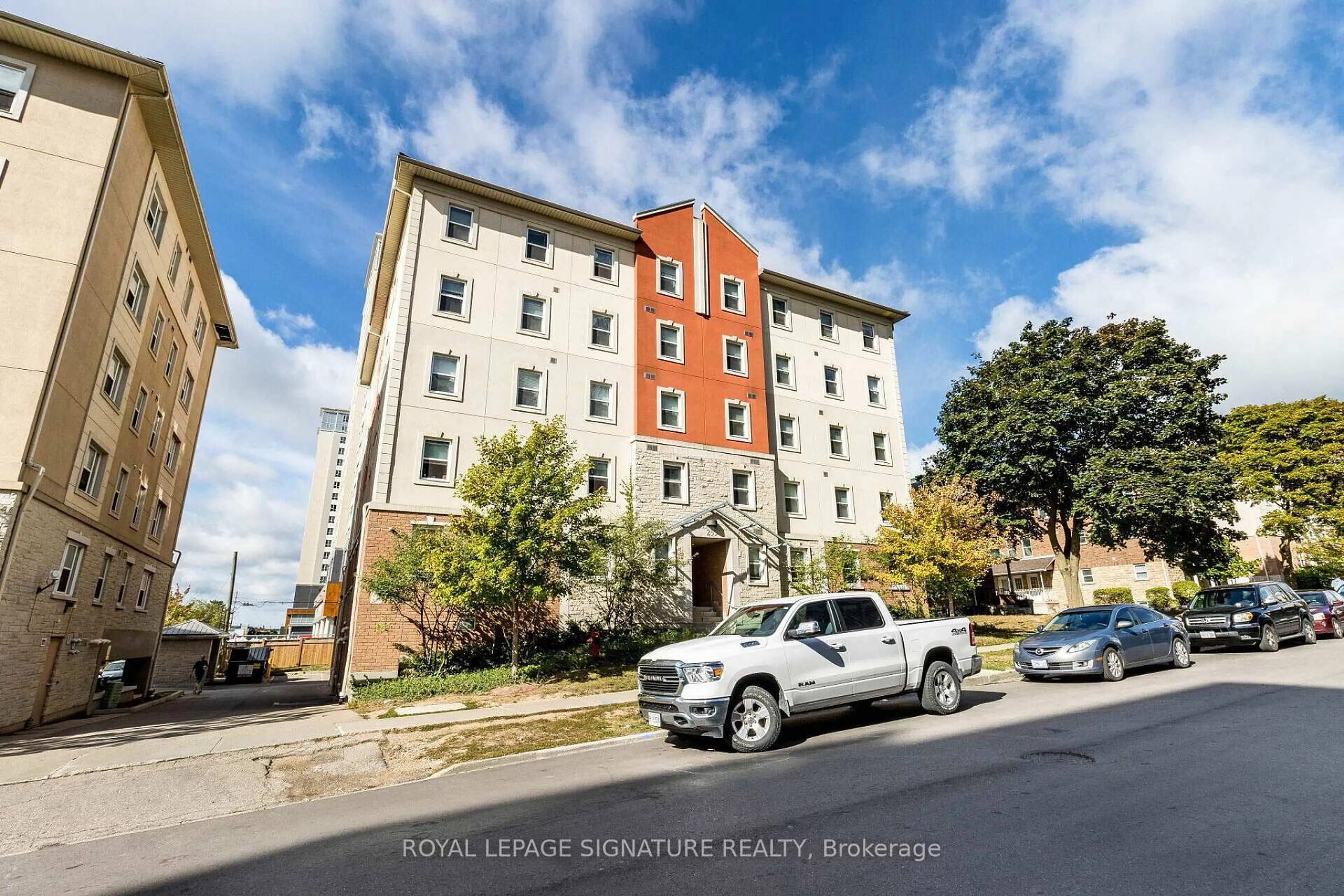 A pic from outside/outdoor area/front of a property/back of a property/a pic from drone, building for 253 Lester St #203, Waterloo Ontario N2L 3W6