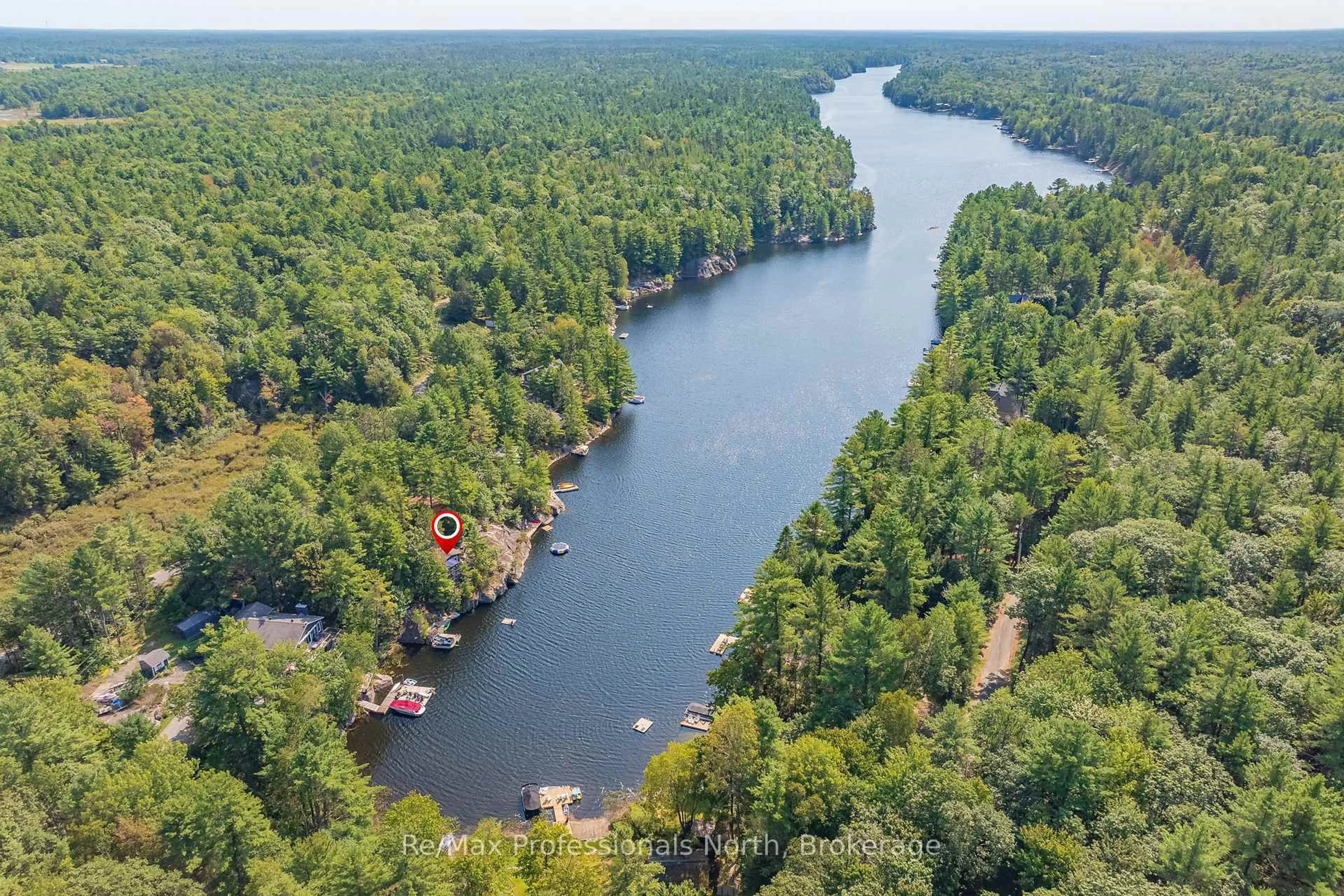 A pic from outside/outdoor area/front of a property/back of a property/a pic from drone, water/lake/river/ocean view for 1118 Tomingas Rd, Gravenhurst Ontario P1P 0G3