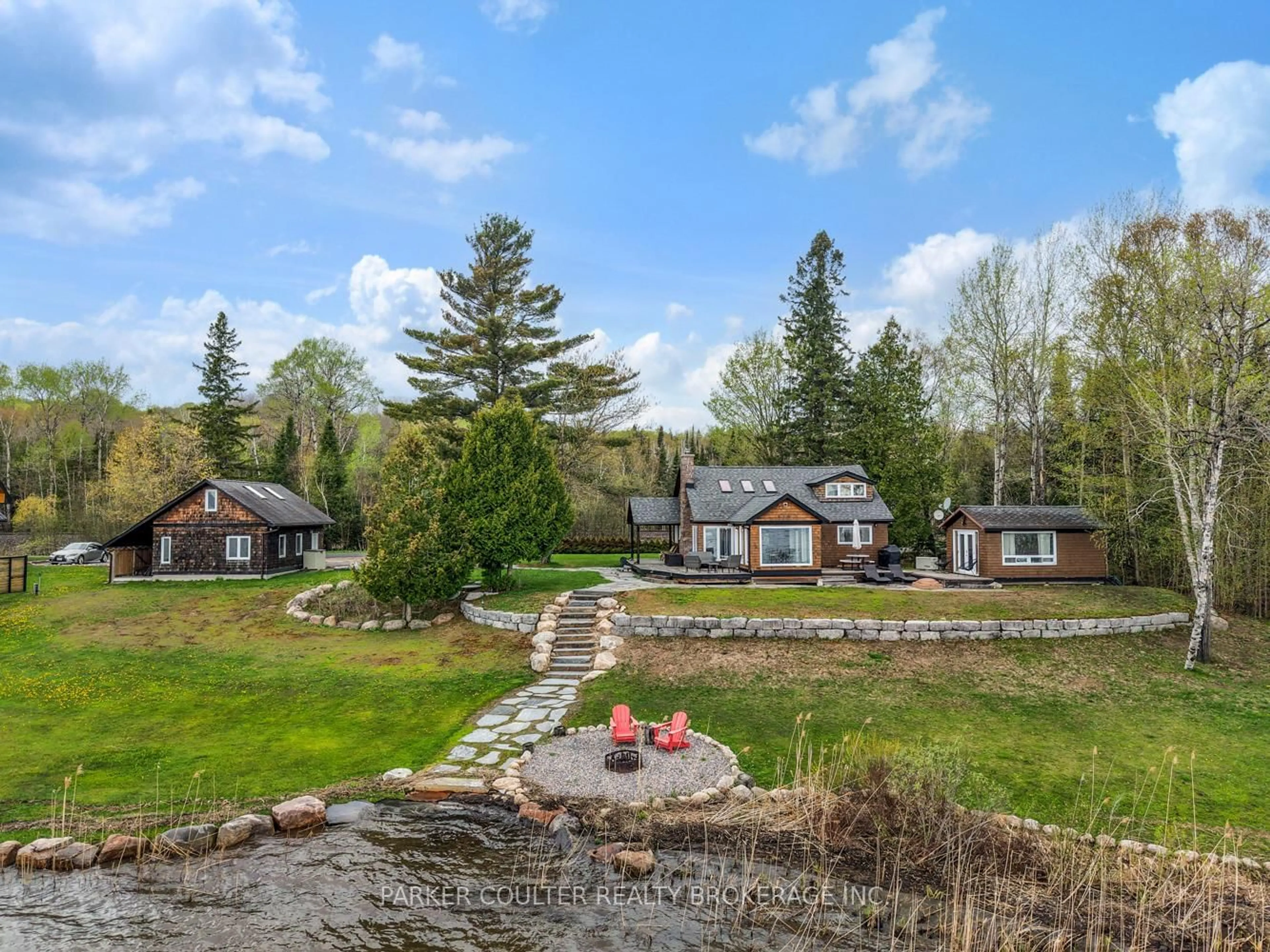 A pic from outside/outdoor area/front of a property/back of a property/a pic from drone, water/lake/river/ocean view for 89 High Rock Dr, Sundridge Ontario P0A 1Z0