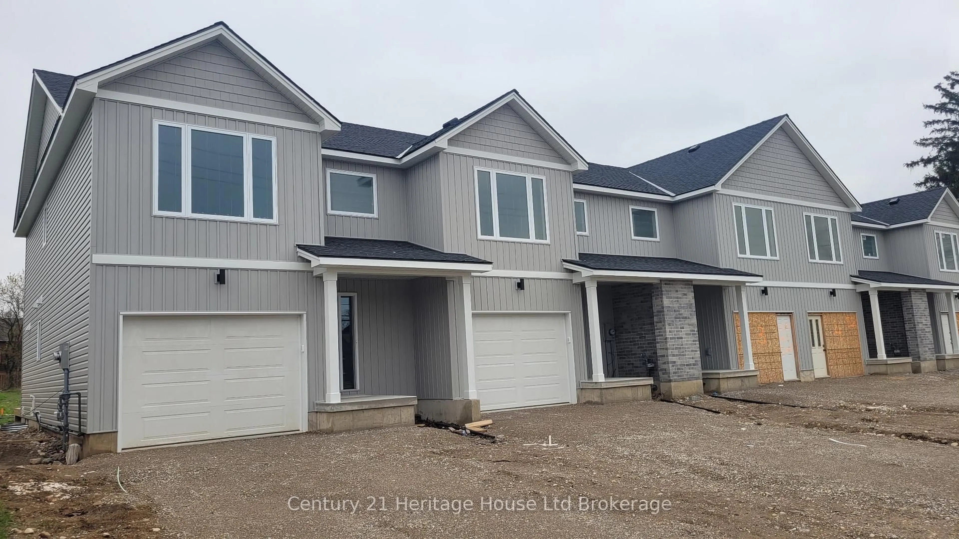 Home with vinyl exterior material, street for 52 Park Row, Woodstock Ontario N4S 1V8