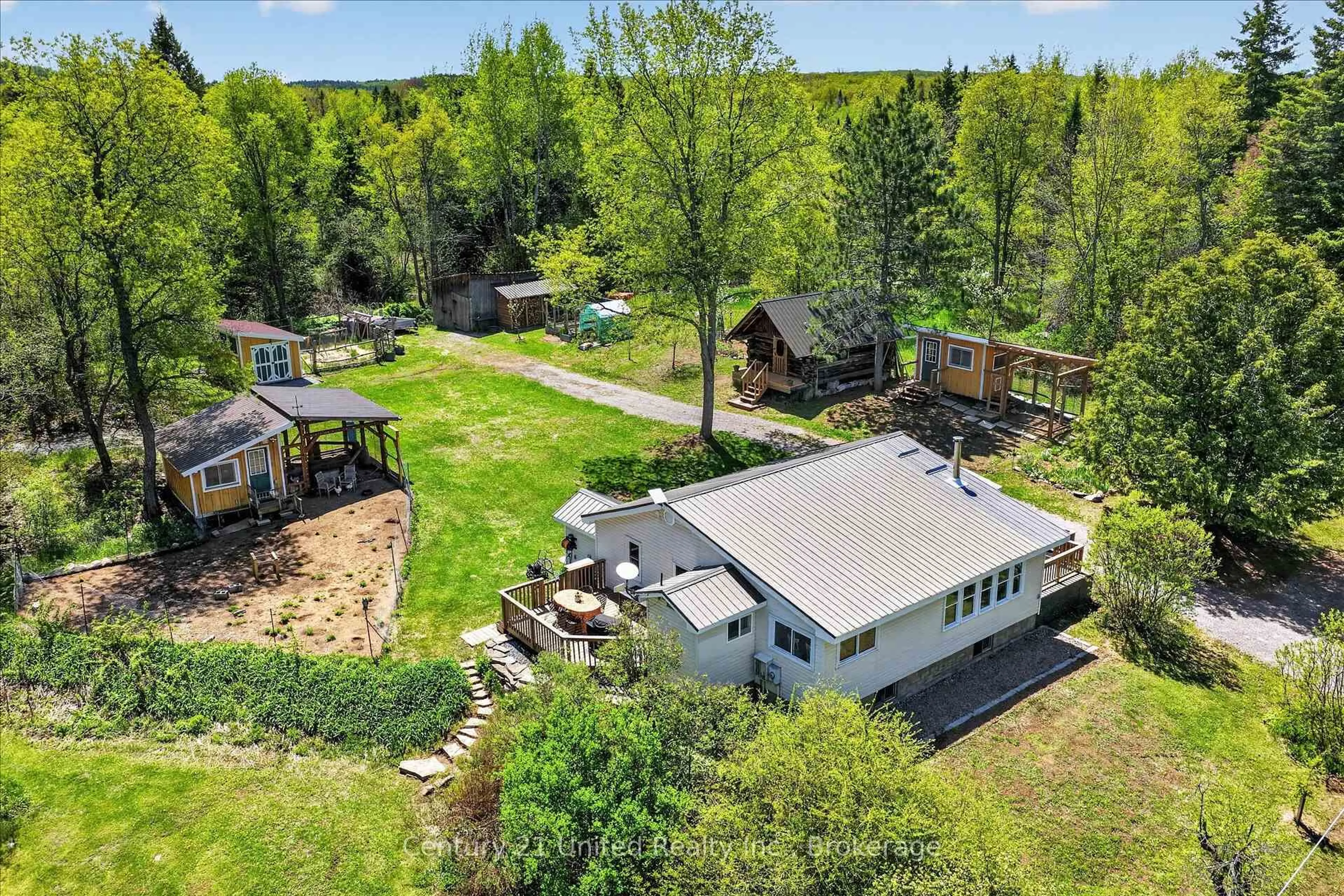 A pic from outside/outdoor area/front of a property/back of a property/a pic from drone, water/lake/river/ocean view for 4091 Hwy 620, Coe Hill Ontario K0L 1P0