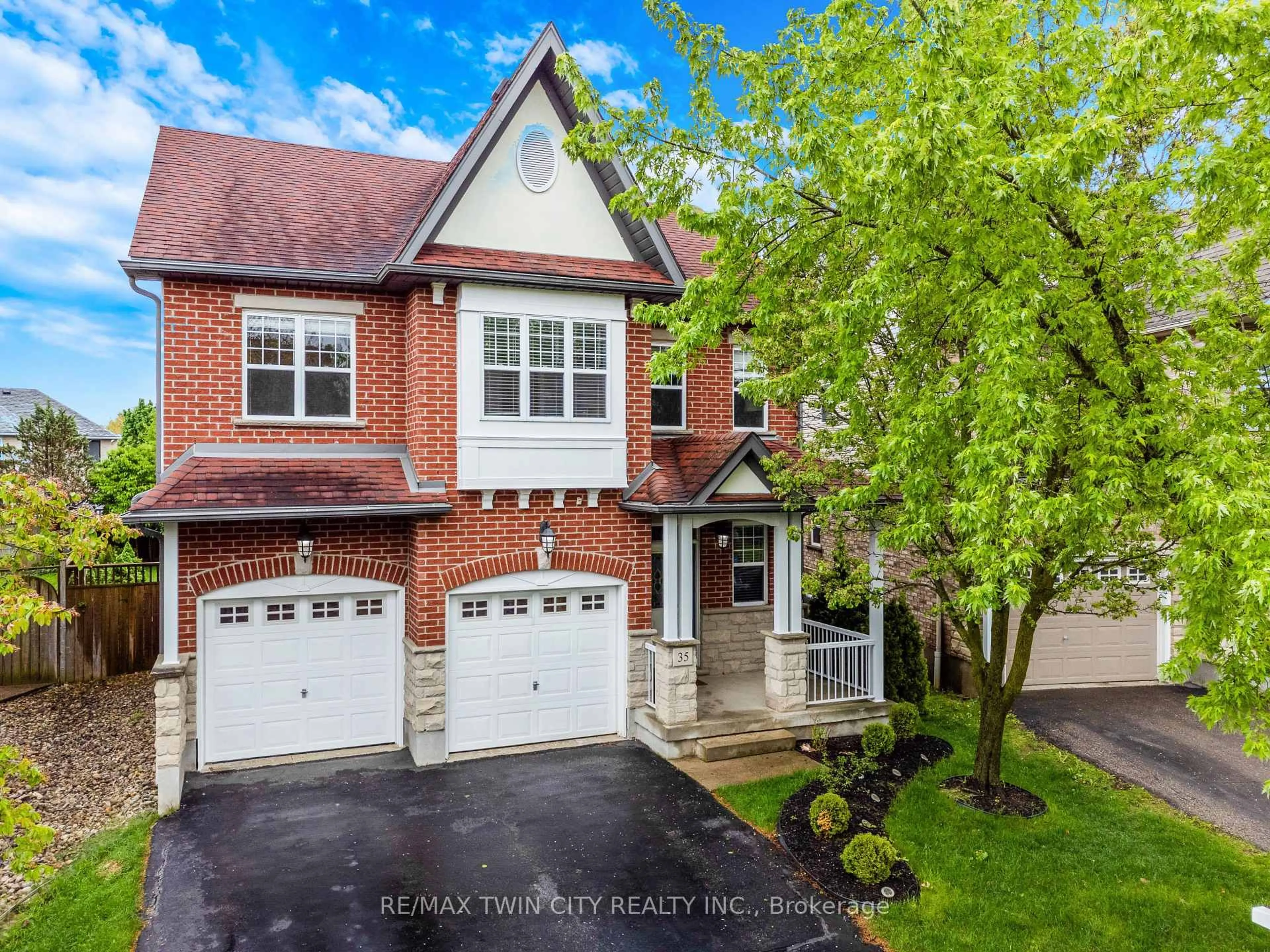 Home with brick exterior material, street for 35 Coopershawk St, Kitchener Ontario N2K 4J7