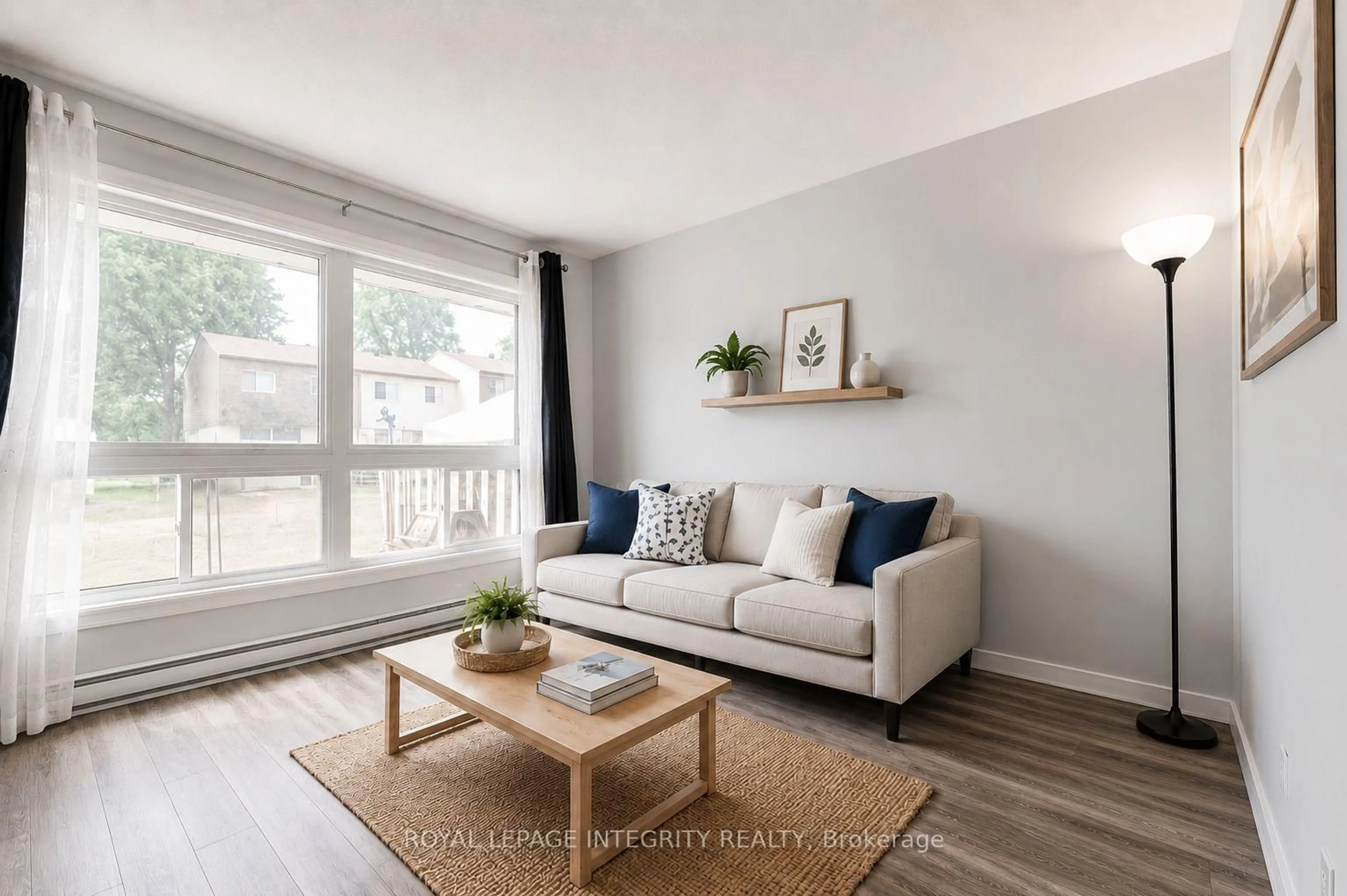 Living room with furniture, wood/laminate floor for 46 FORESTER Cres #B, Ottawa Ontario K2H 8Y4
