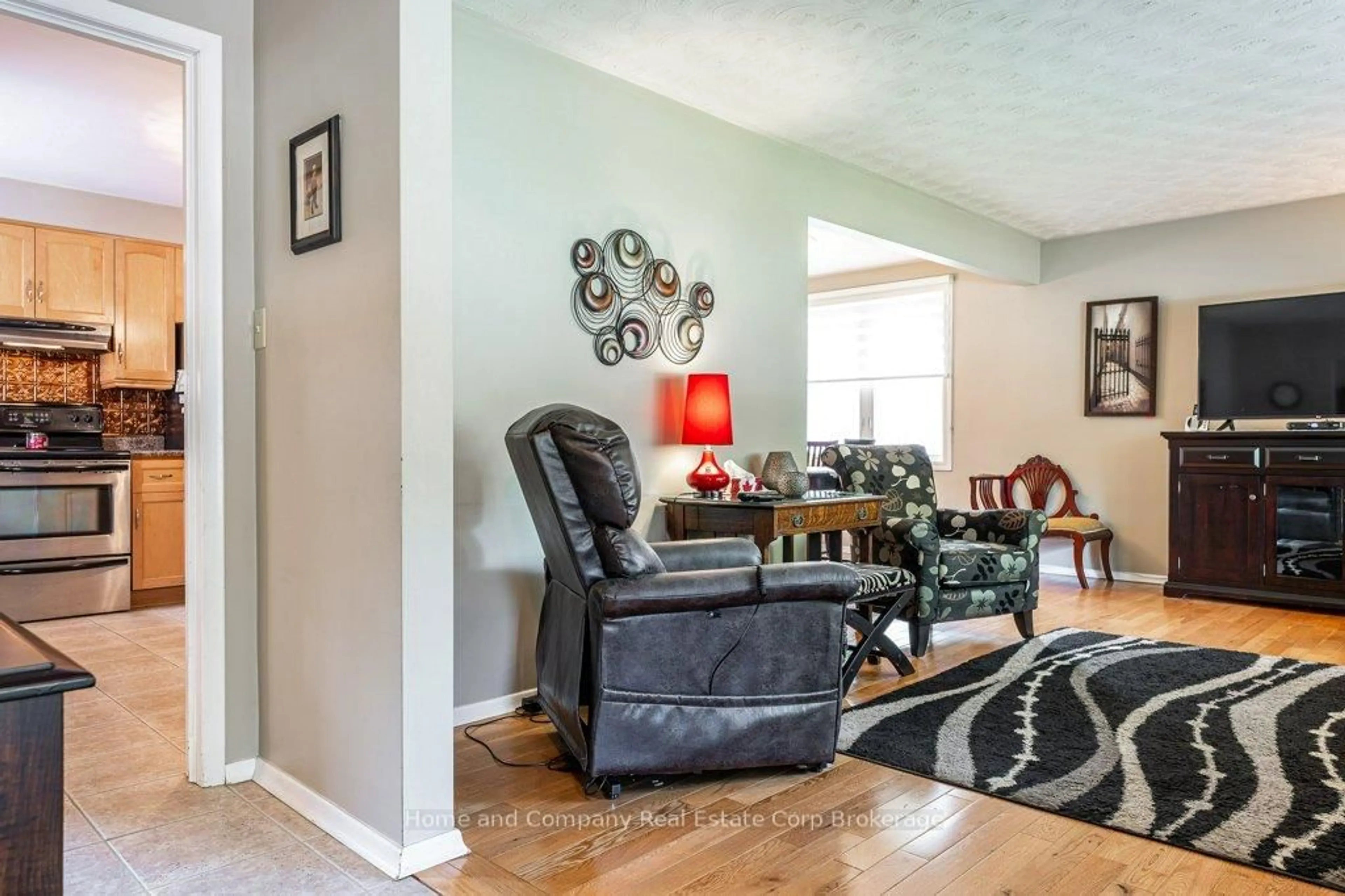 Living room with furniture, wood/laminate floor for 271 Devon St, Stratford Ontario N5A 3A1