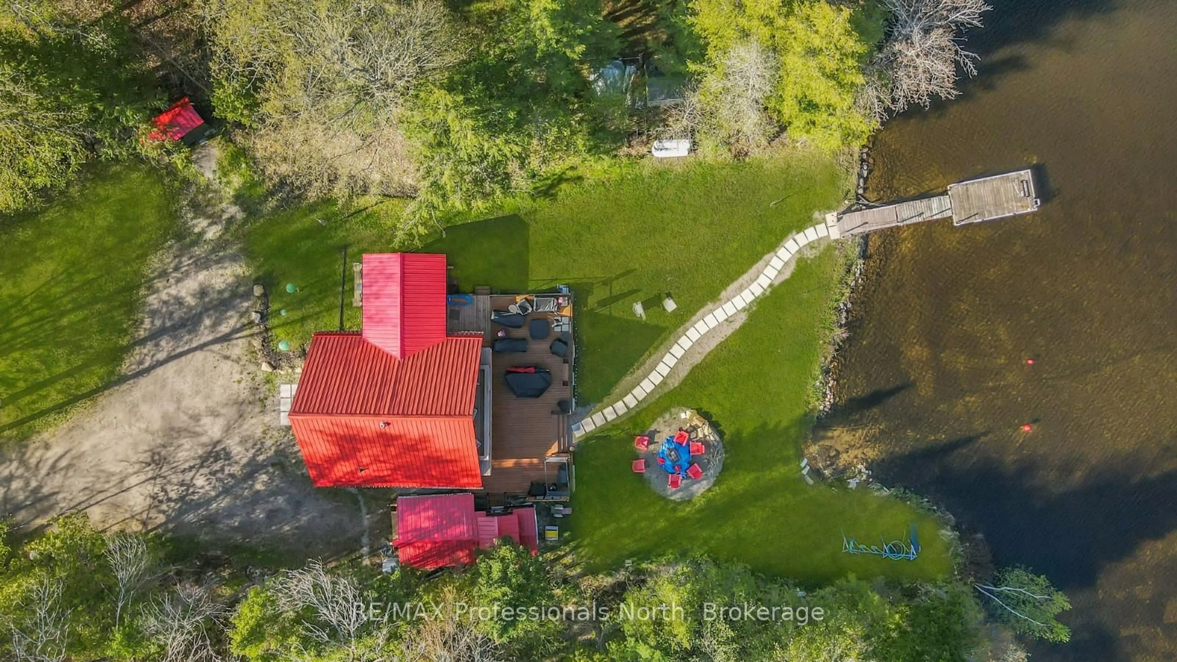 A pic from outside/outdoor area/front of a property/back of a property/a pic from drone, water/lake/river/ocean view for 1096 Gravel Pit Rd, Minden Hills Ontario K0M 2K0