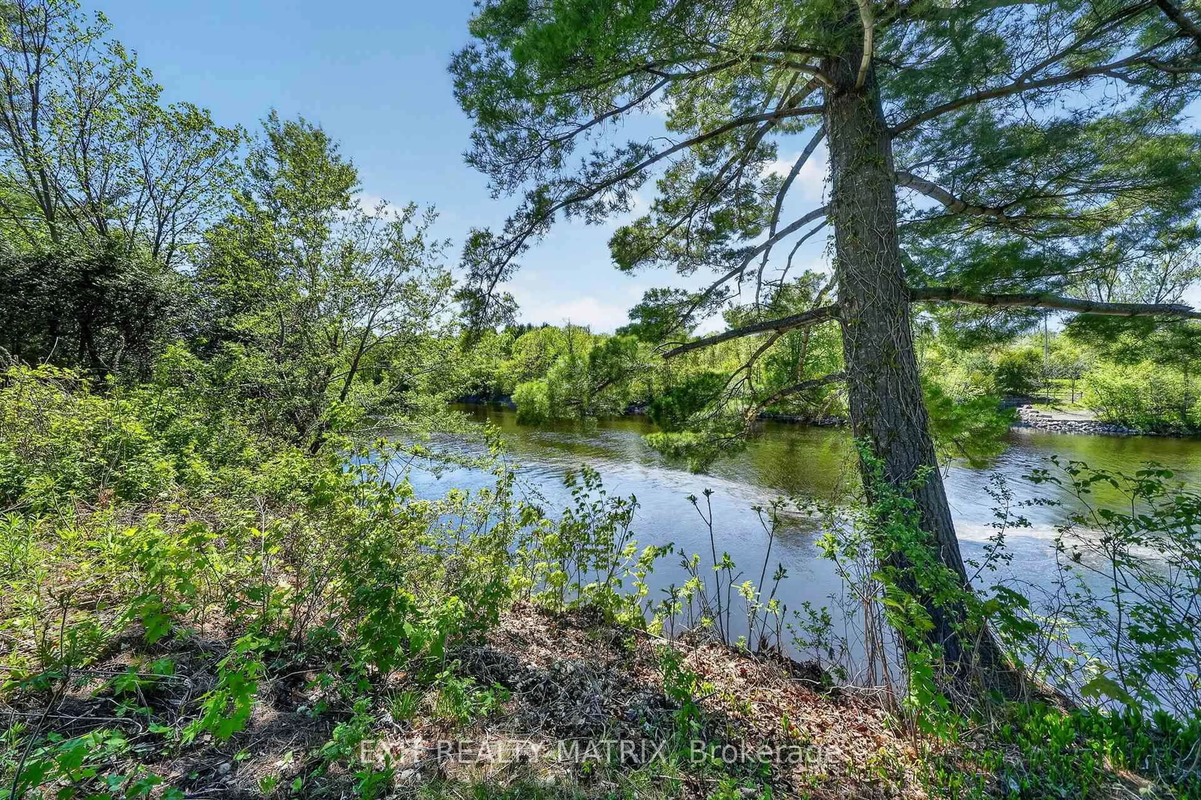 A pic from outside/outdoor area/front of a property/back of a property/a pic from drone, water/lake/river/ocean view for 5056 Nicolls Island Rd, Ottawa Ontario K4M 0E2