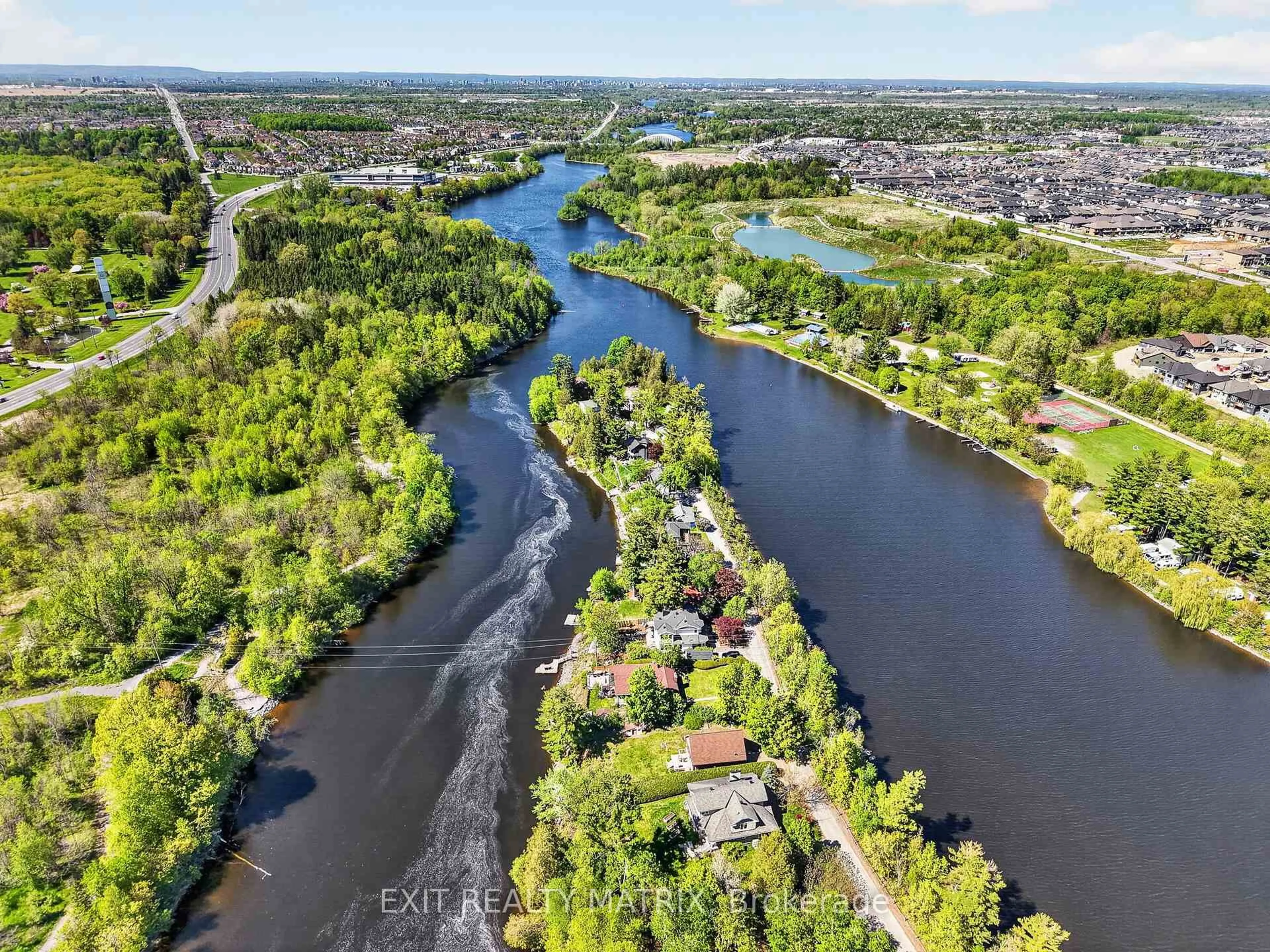 A pic from outside/outdoor area/front of a property/back of a property/a pic from drone, water/lake/river/ocean view for 5056 Nicolls Island Rd, Ottawa Ontario K4M 0E2