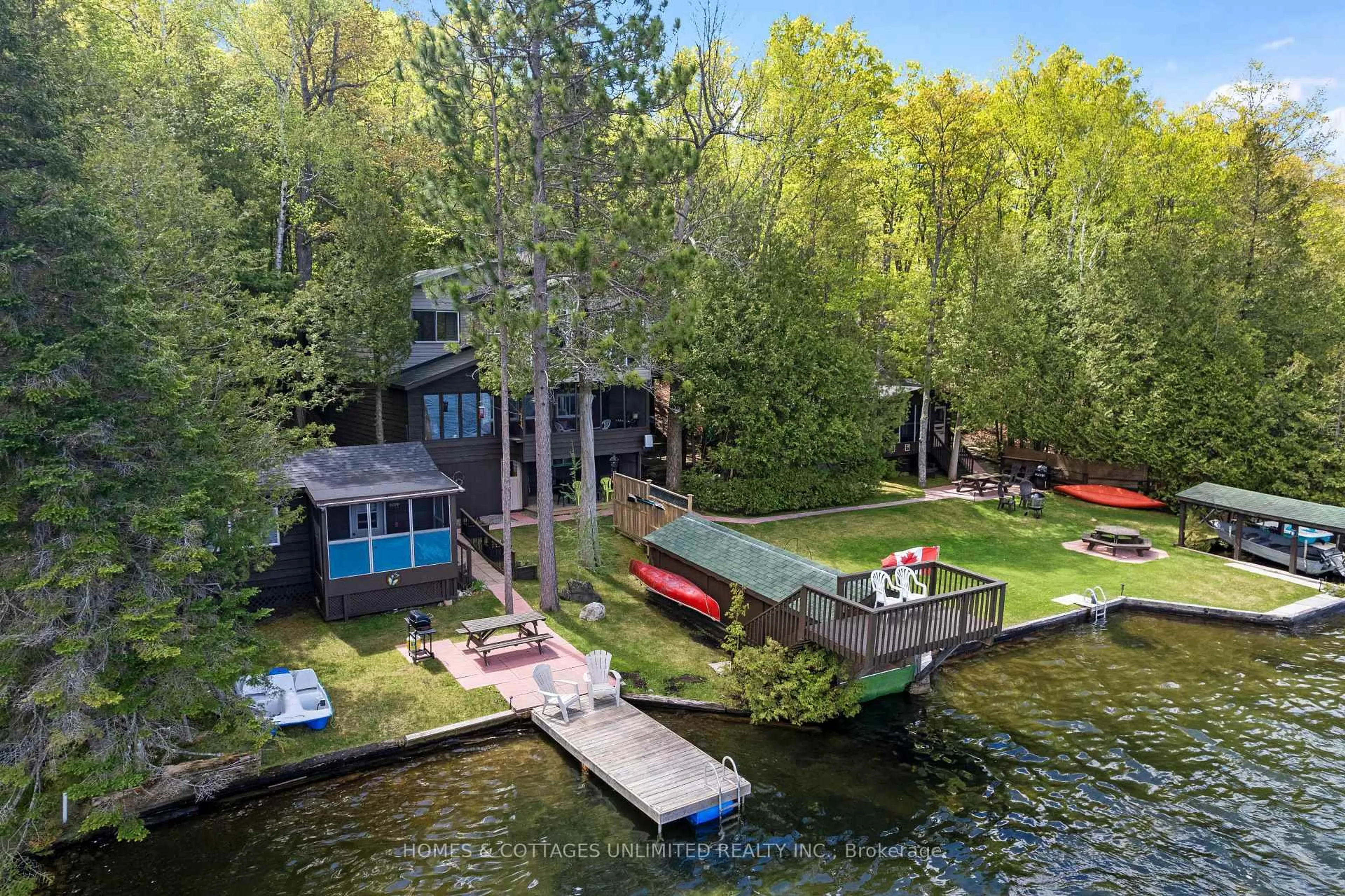 A pic from outside/outdoor area/front of a property/back of a property/a pic from drone, water/lake/river/ocean view for 1070 Young Lane, Ompah Ontario K0H 2J0