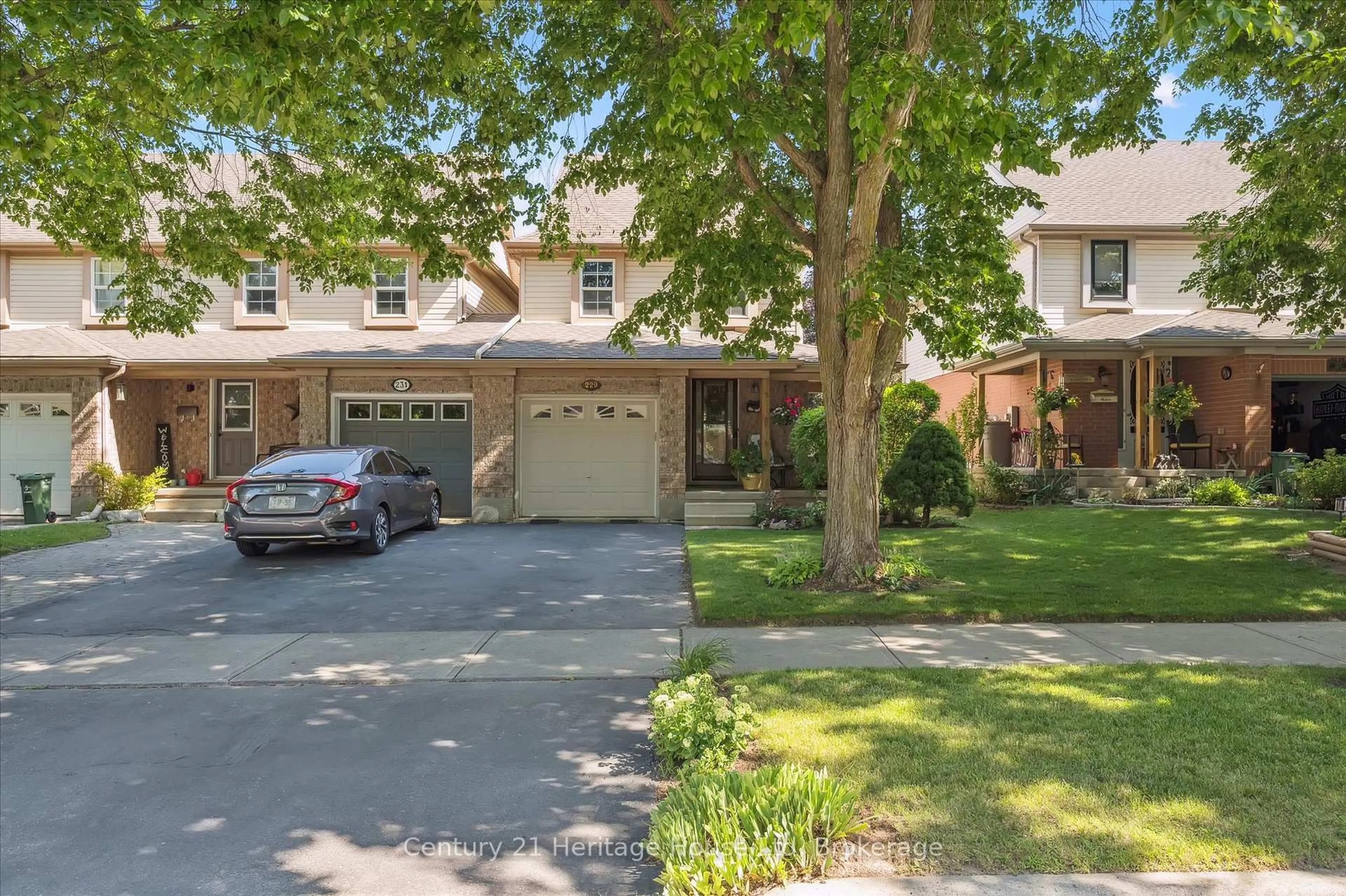 Home with brick exterior material, street for 229 Silurian Dr, Guelph Ontario N1E 7B8