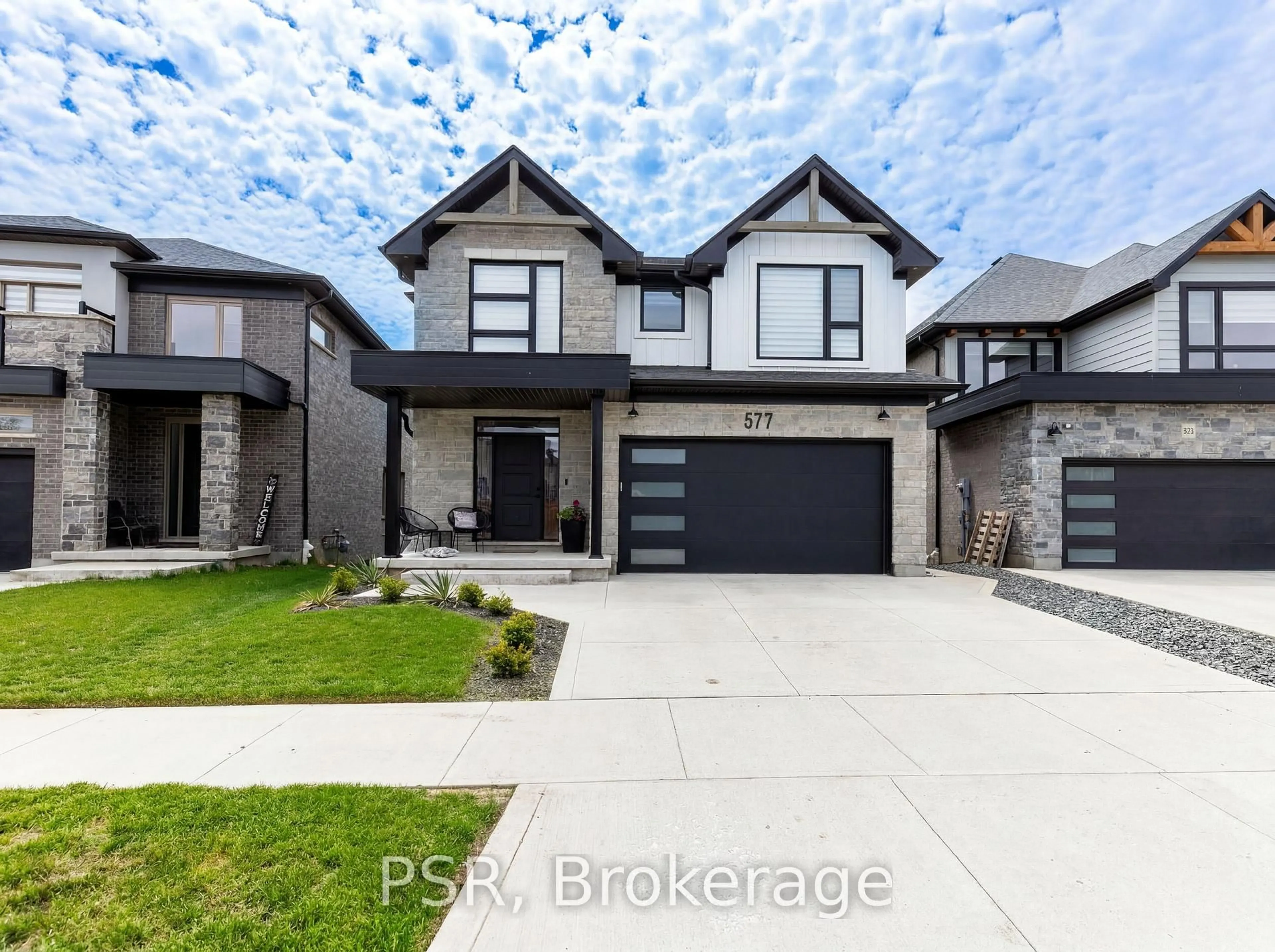 Home with brick exterior material, street for 577 Doonwoods Cres, Kitchener Ontario N2P 0E5