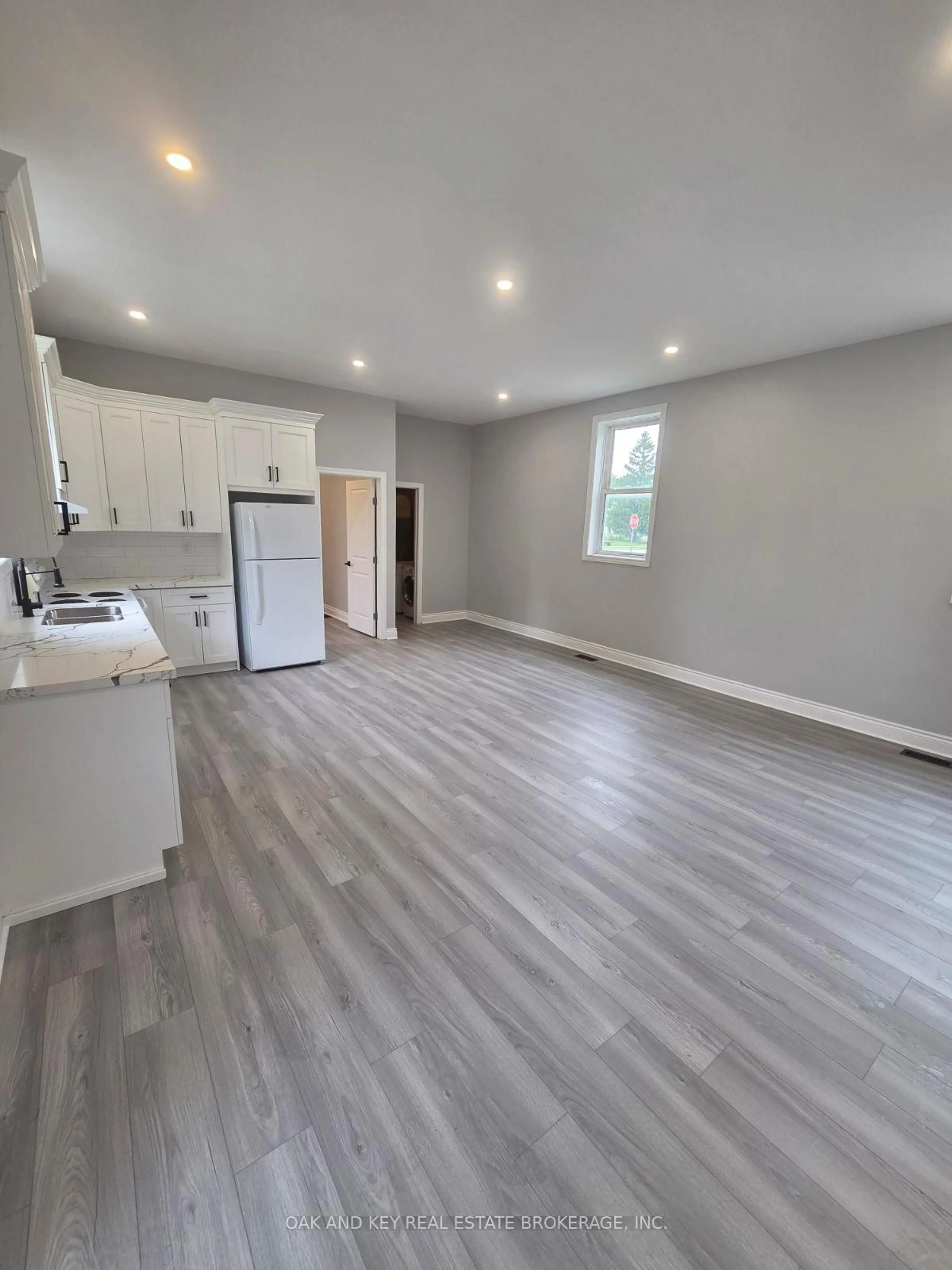 Open concept kitchen, wood/laminate floor for 22933 Hagerty Rd, Newbury Ontario N0L 1Z0