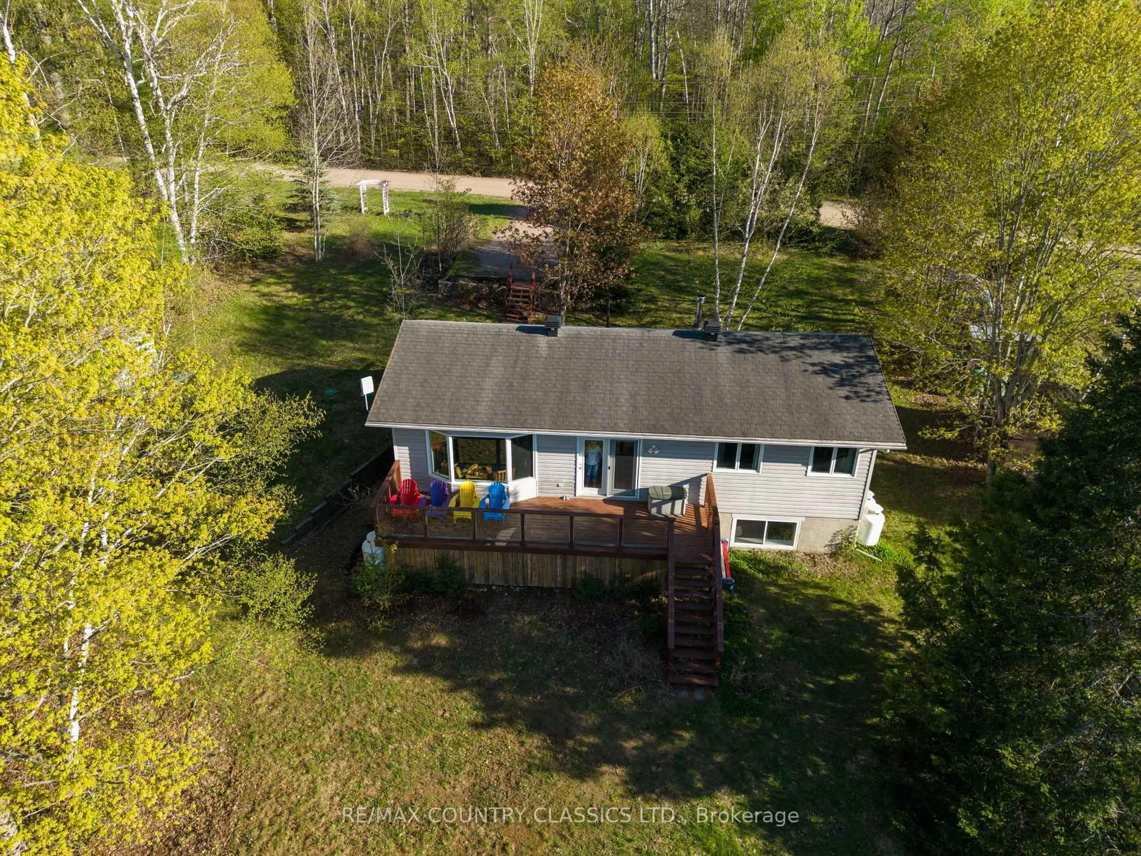 A pic from outside/outdoor area/front of a property/back of a property/a pic from drone, water/lake/river/ocean view for 125 Marina Rd, Bancroft Ontario K0L 1C0