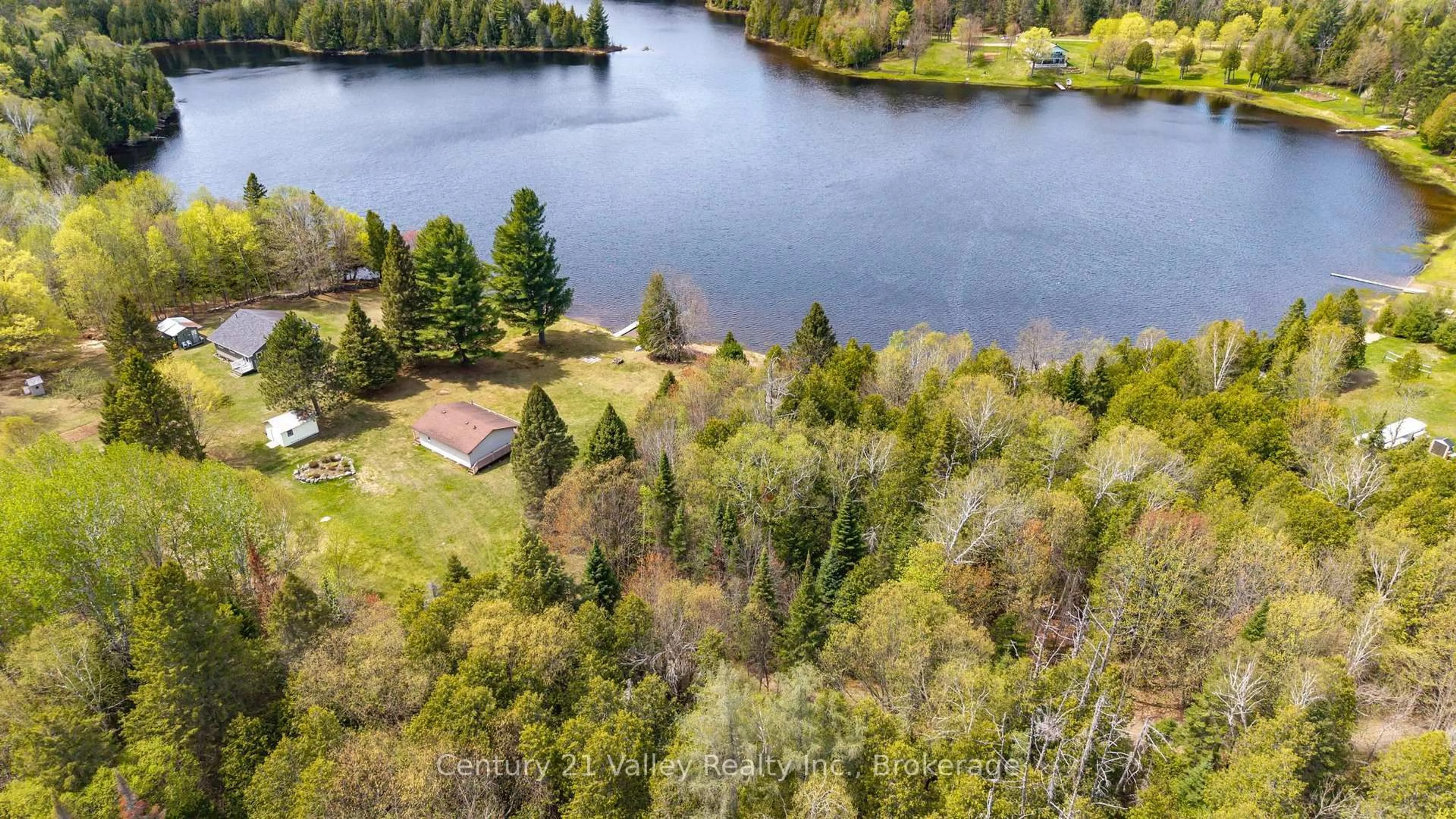 A pic from outside/outdoor area/front of a property/back of a property/a pic from drone, water/lake/river/ocean view for 89A Lake Lapinskie Lane, Wilno Ontario K0J 2N0