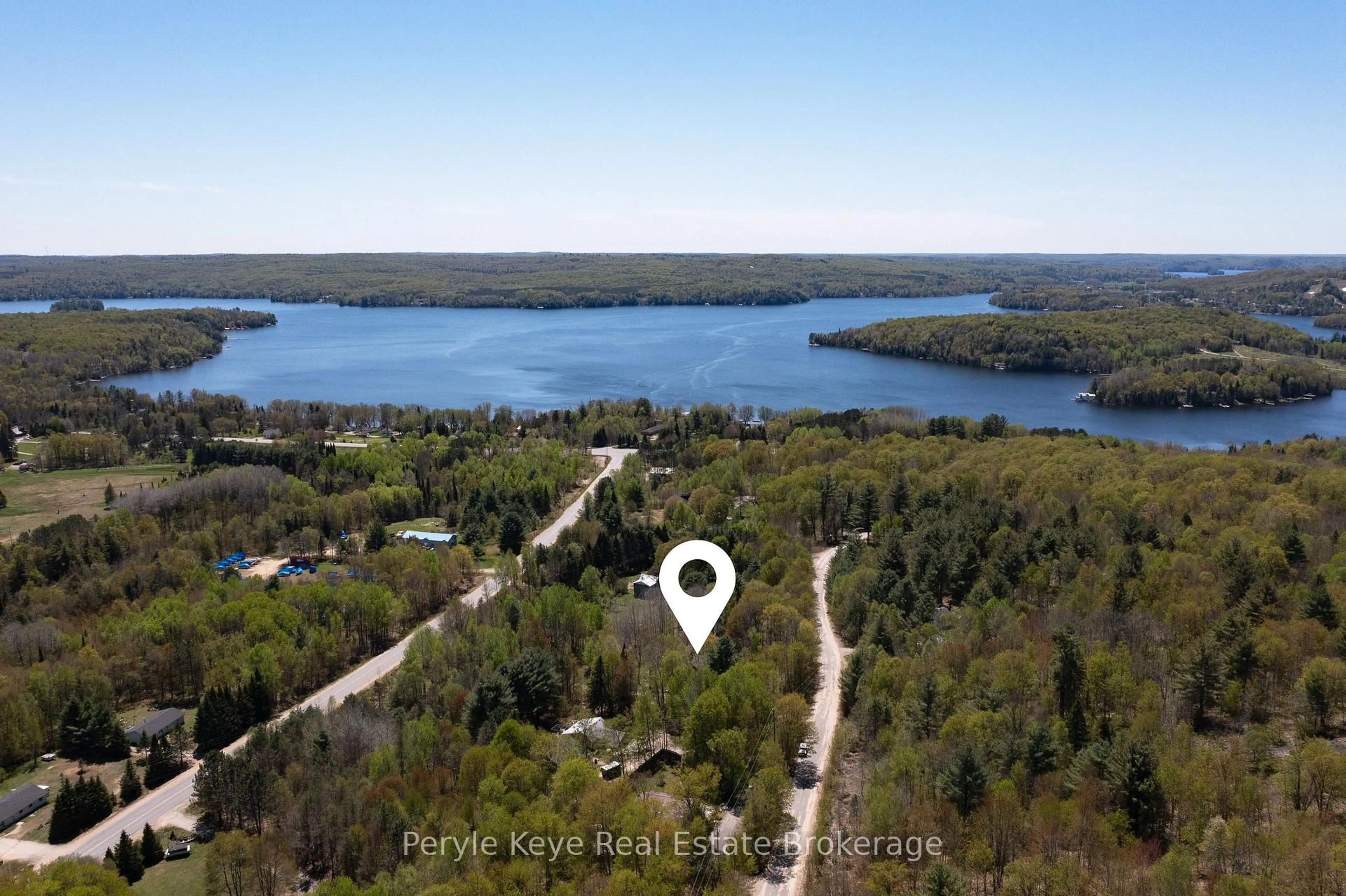 A pic from outside/outdoor area/front of a property/back of a property/a pic from drone, water/lake/river/ocean view for 1042 Hillside Cres, Lake of Bays Ontario P1H 2J6
