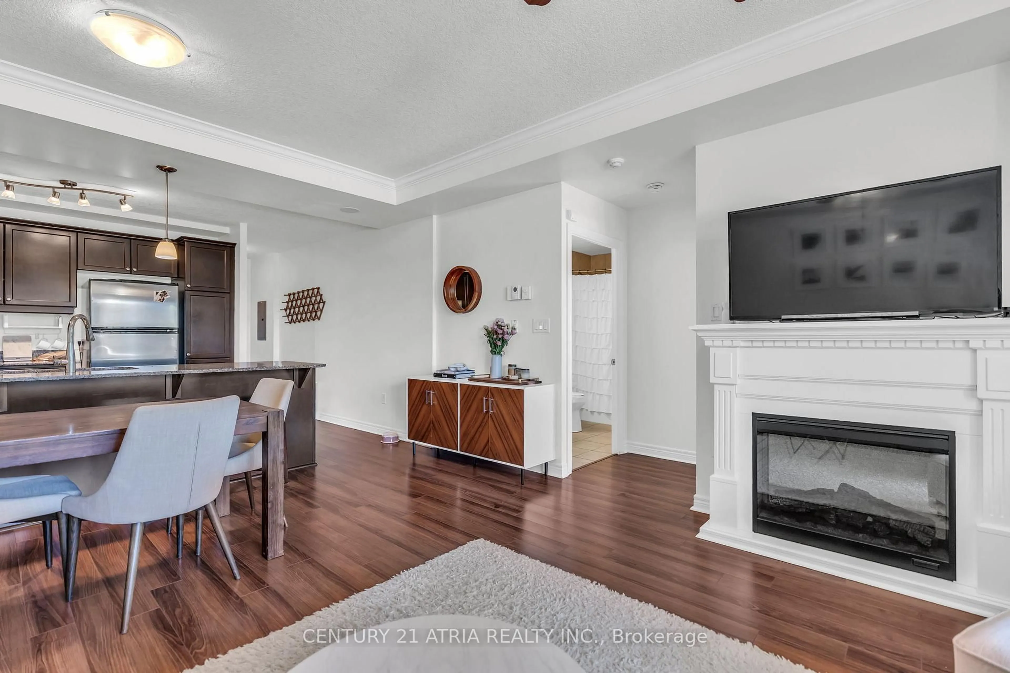 Living room with furniture, wood/laminate floor for 1030 Coronation Dr #101, London North Ontario N6G 0G5