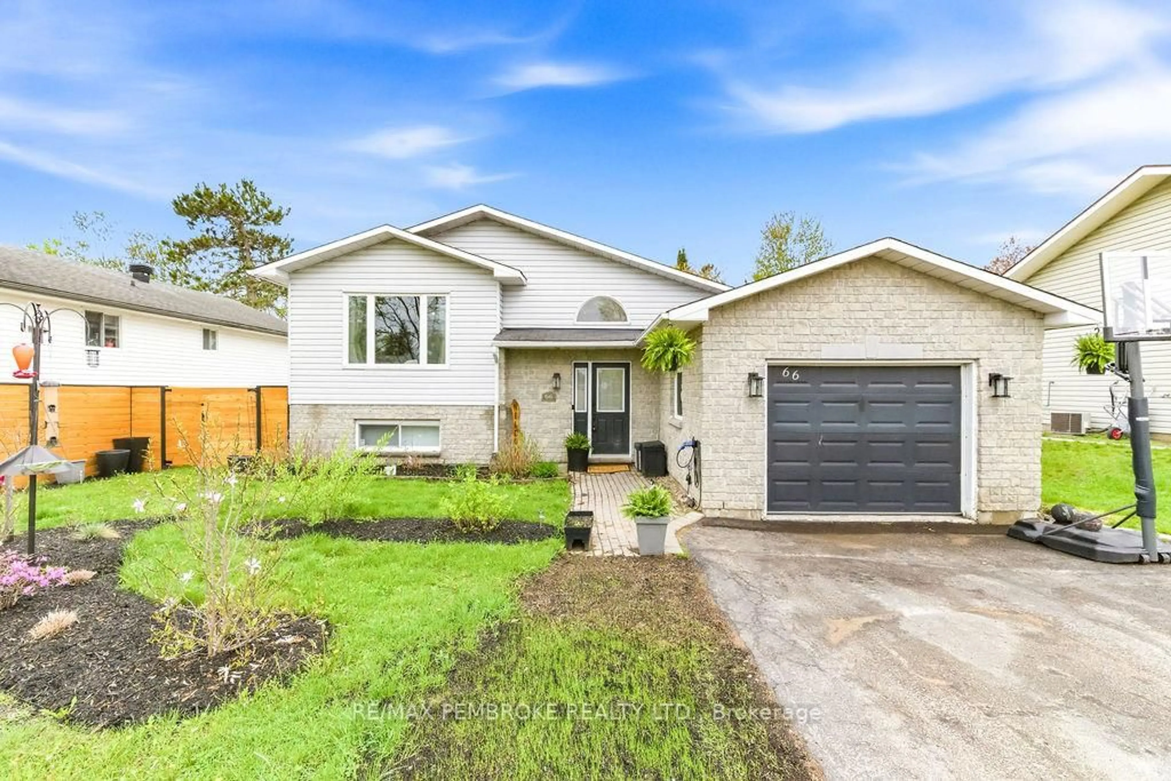 Home with brick exterior material, street for 66 Woodland Cres, Petawawa Ontario K8H 3M1
