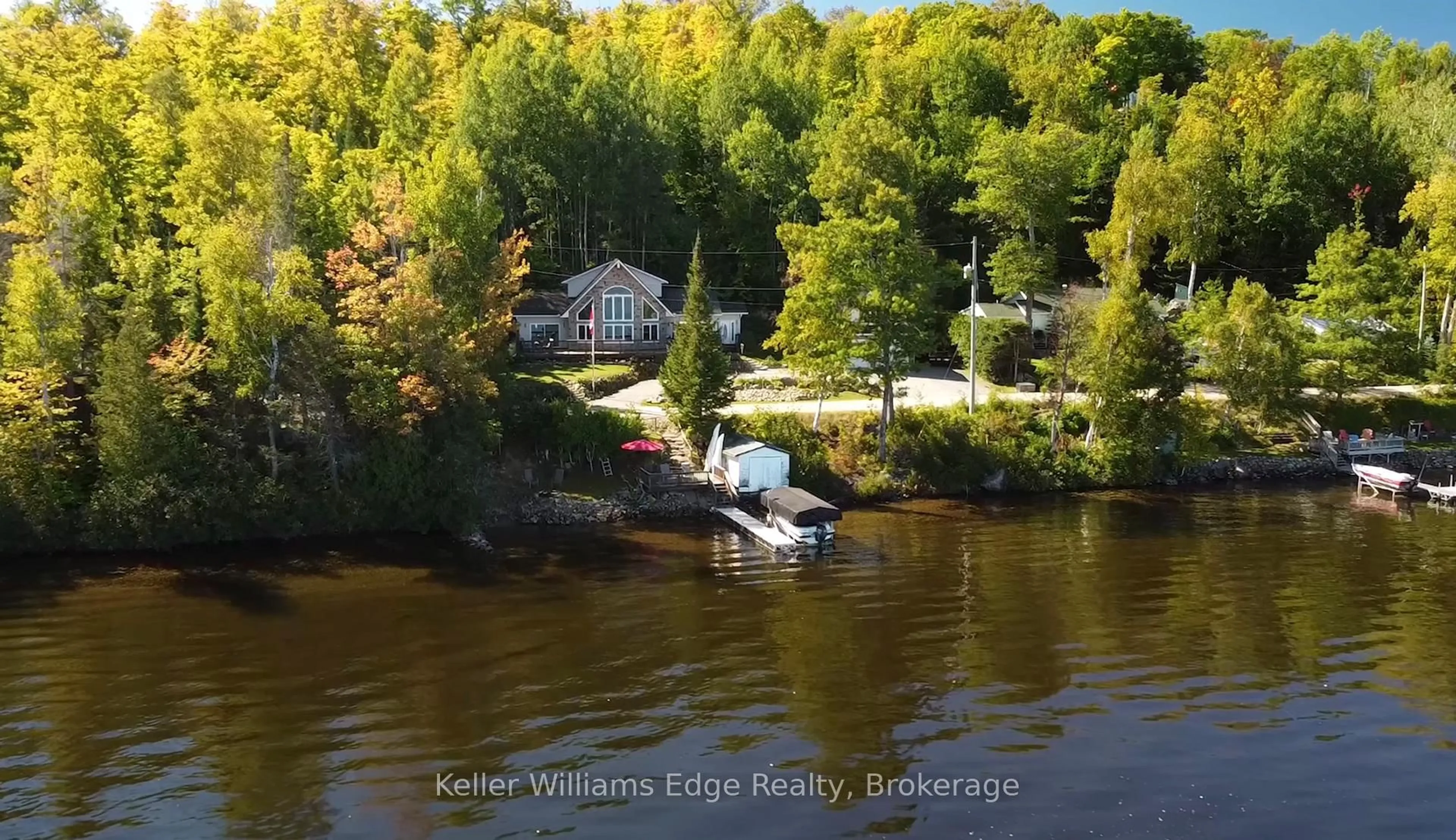A pic from outside/outdoor area/front of a property/back of a property/a pic from drone, water/lake/river/ocean view for 43 LAKESHORE Dr, Combermere Ontario K0J 1L0