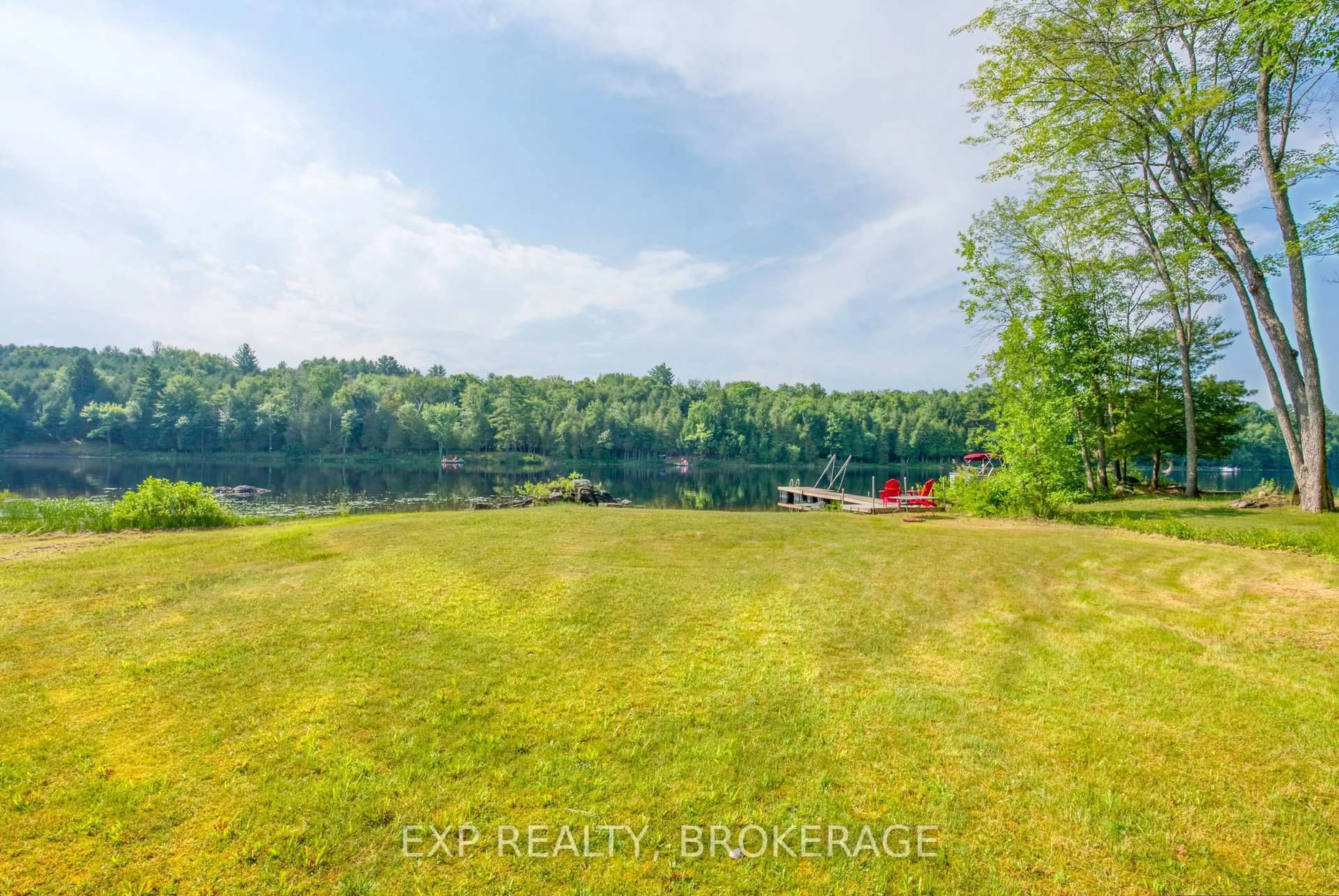 A pic from outside/outdoor area/front of a property/back of a property/a pic from drone, water/lake/river/ocean view for 1036 Turner Way, Arden Ontario K0H 1B0
