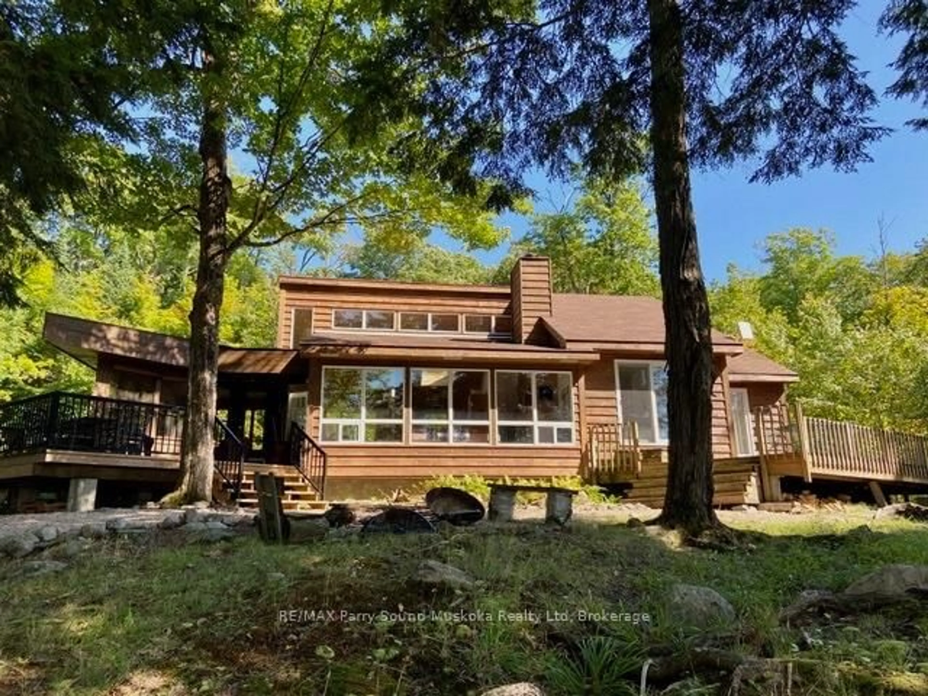 A pic from outside/outdoor area/front of a property/back of a property/a pic from drone, water/lake/river/ocean view for 47 Neighick Lake Rd, Magnetawan Ontario P0A 1A0