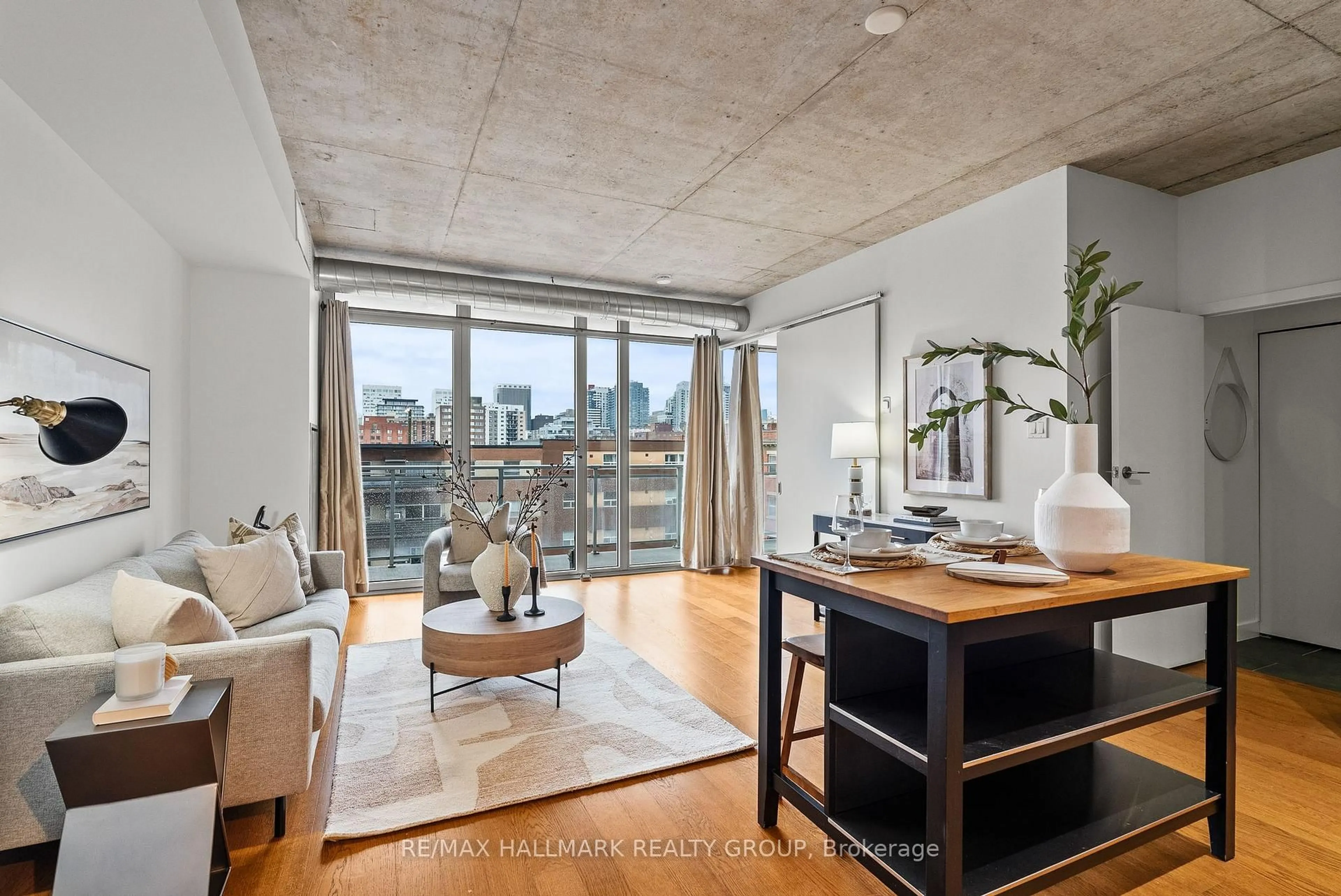 Living room with furniture, cement floor for 354 Gladstone Ave #332, Ottawa Ontario K2P 0R4