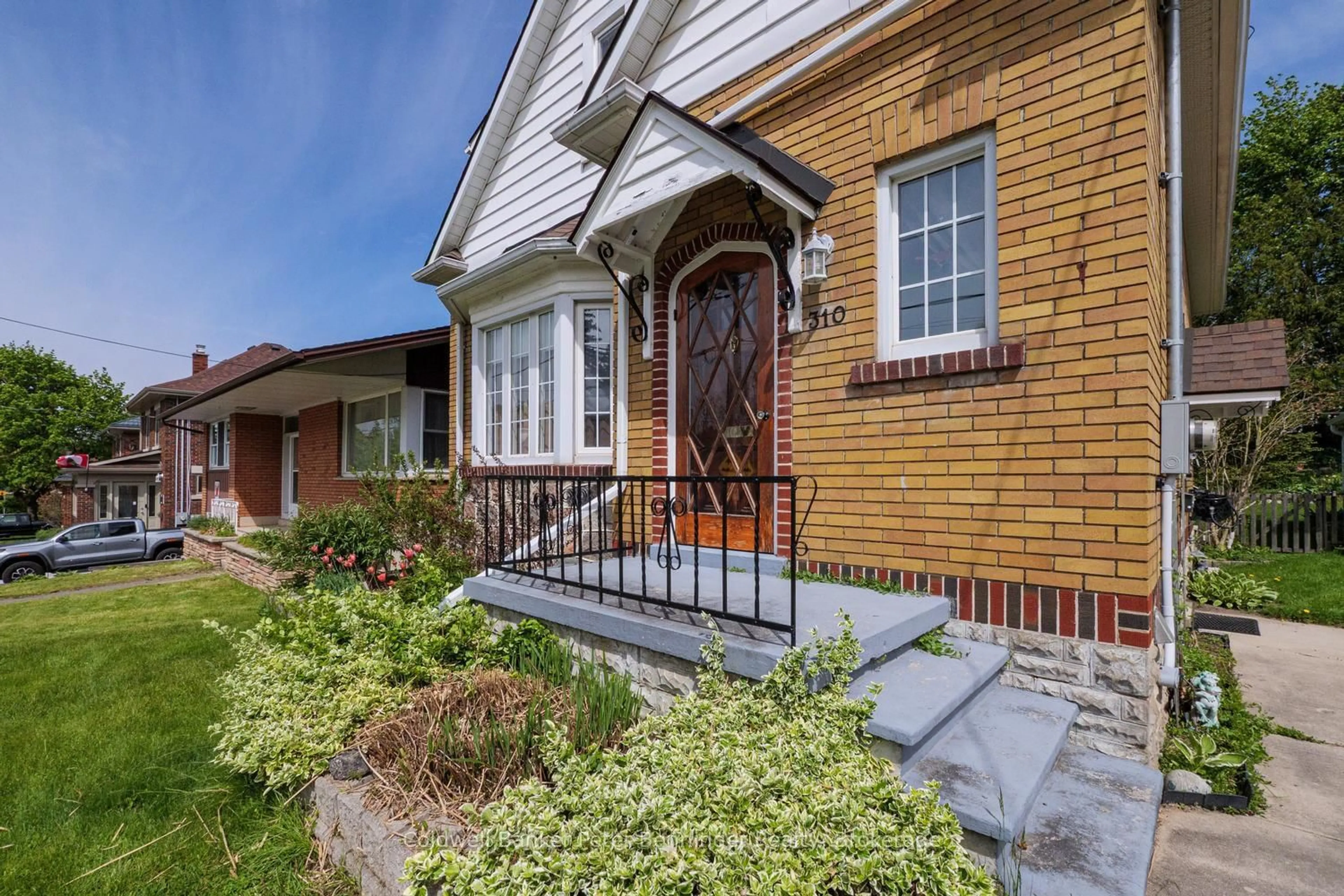 Home with brick exterior material, street for 310 9th St, Hanover Ontario N4N 1L4