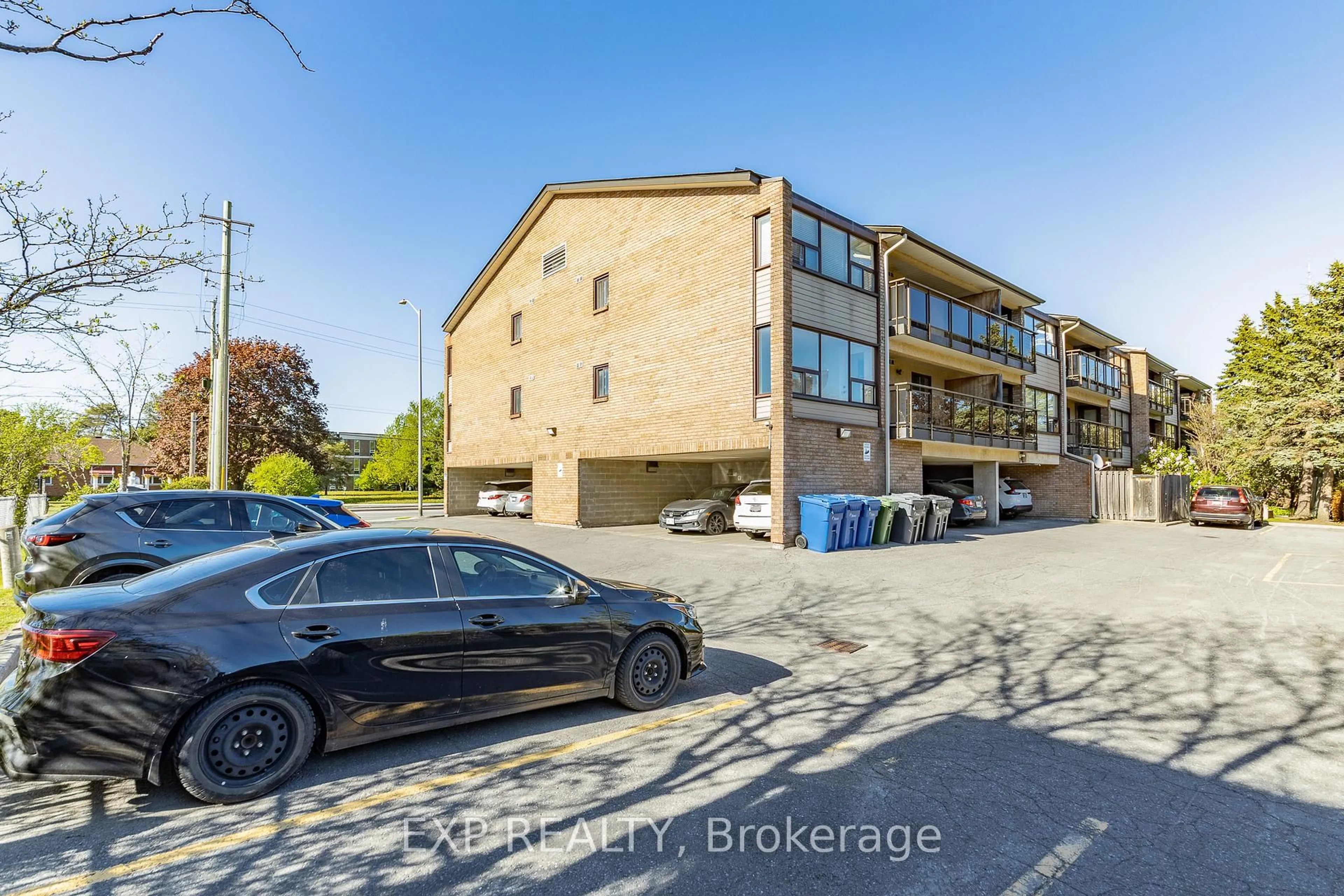 A pic from outside/outdoor area/front of a property/back of a property/a pic from drone, street for 1490 Heron Rd #305, Ottawa Ontario K1V 6A5