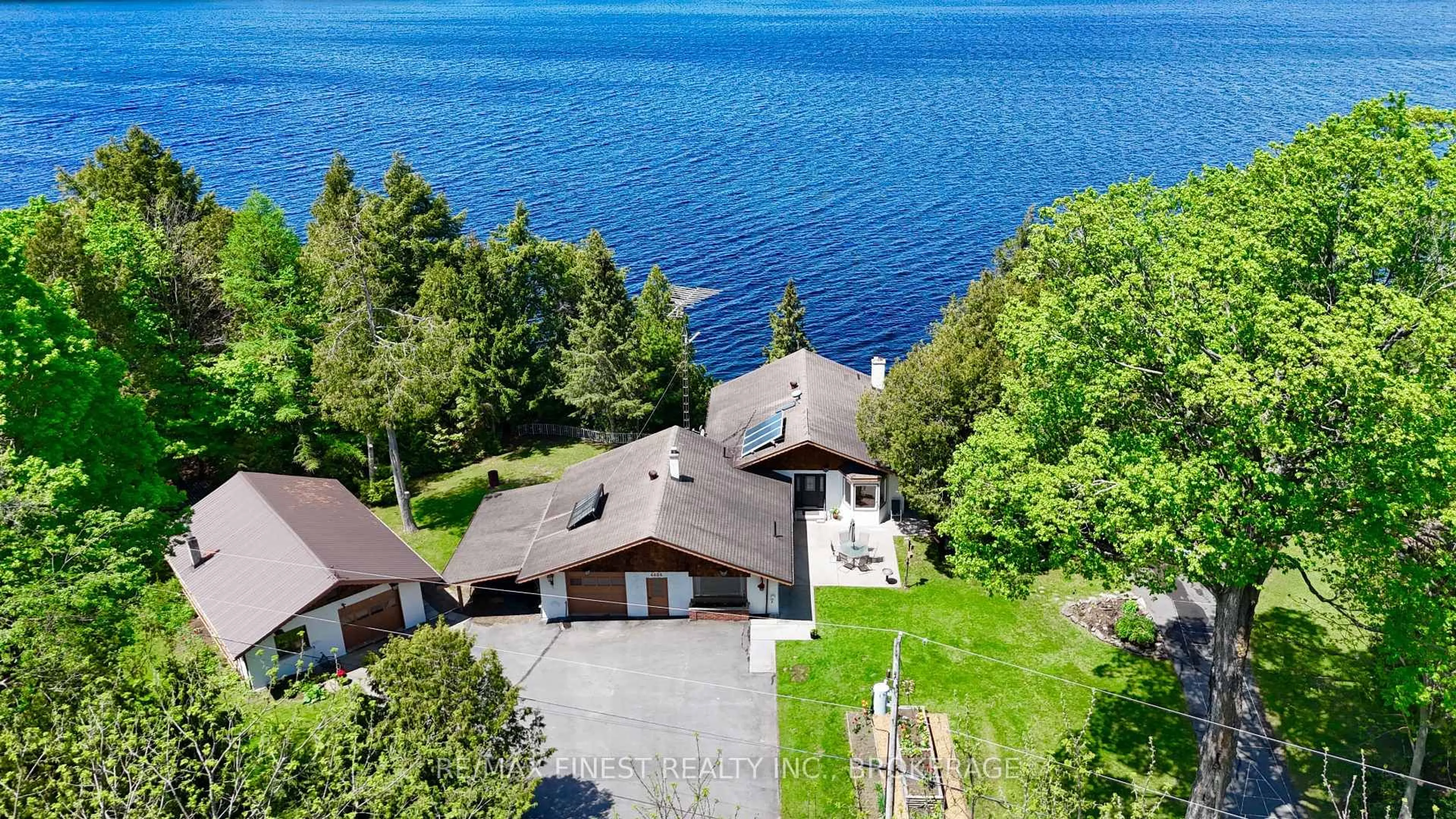A pic from outside/outdoor area/front of a property/back of a property/a pic from drone, water/lake/river/ocean view for 4484 Arthur Court Lane, Inverary Ontario K0H 1X0