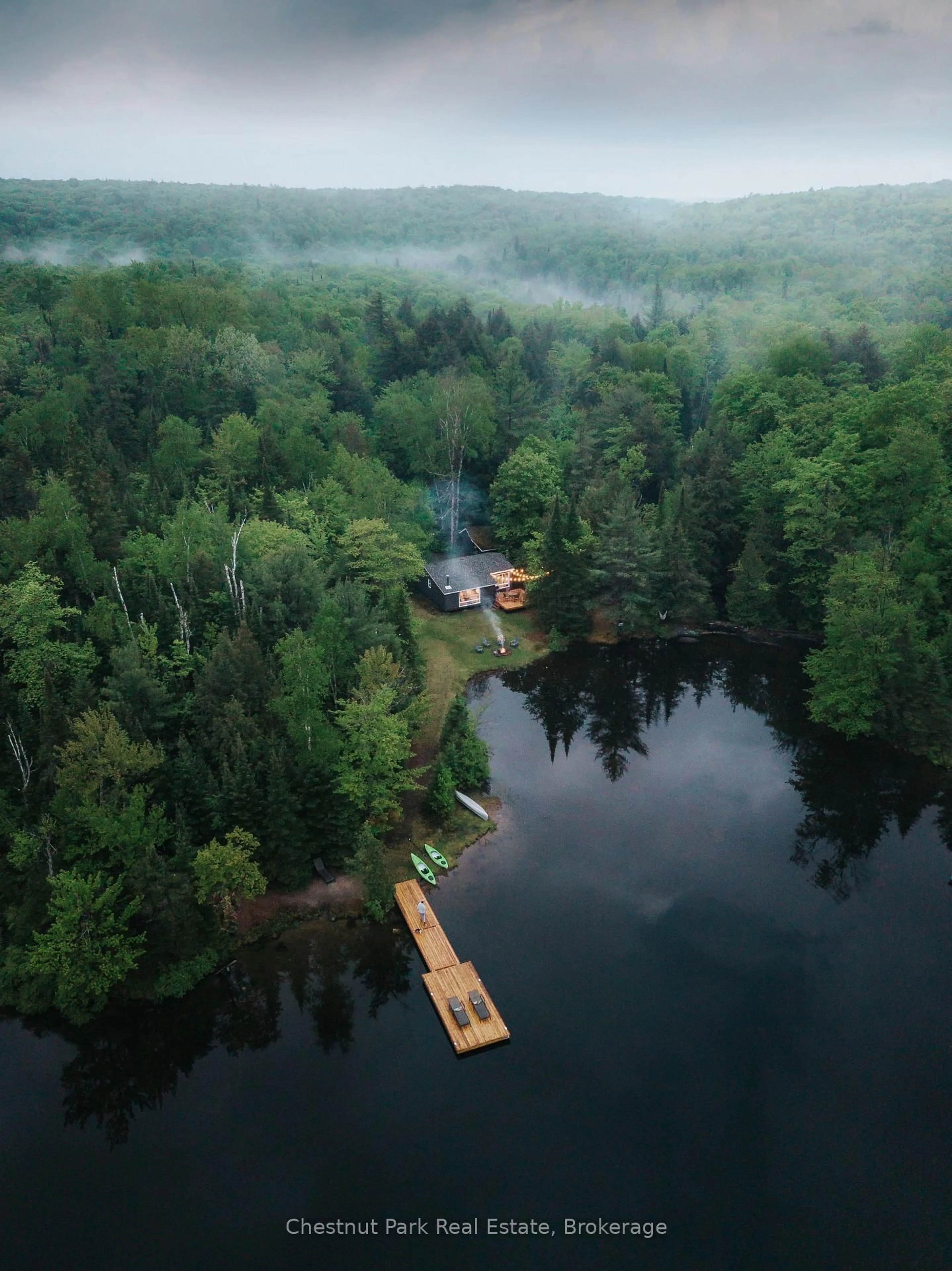 A pic from outside/outdoor area/front of a property/back of a property/a pic from drone, water/lake/river/ocean view for 1097 Bay Lake Rd, Perry Ontario P0A 1J0