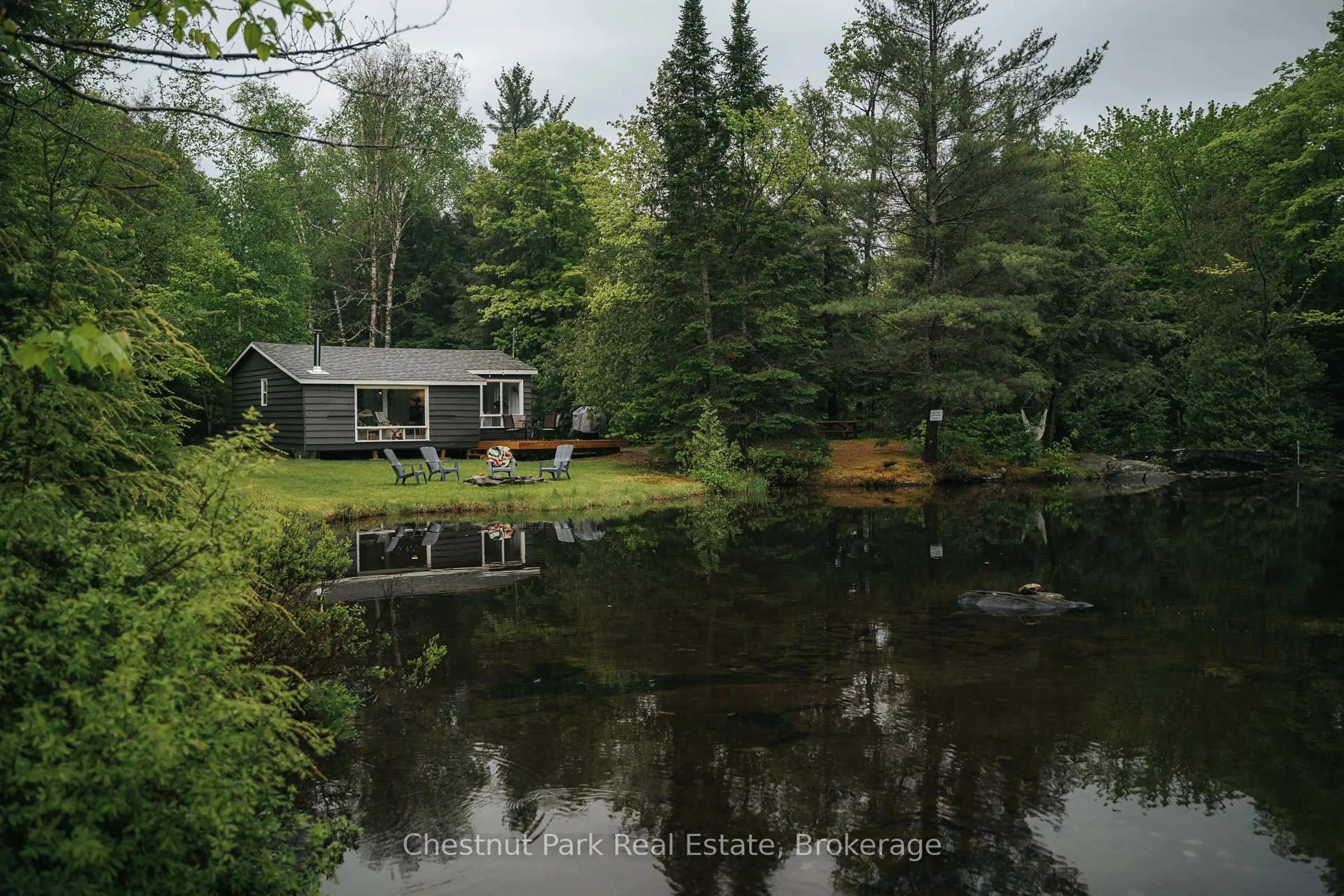 A pic from outside/outdoor area/front of a property/back of a property/a pic from drone, water/lake/river/ocean view for 1097 Bay Lake Rd, Perry Ontario P0A 1J0