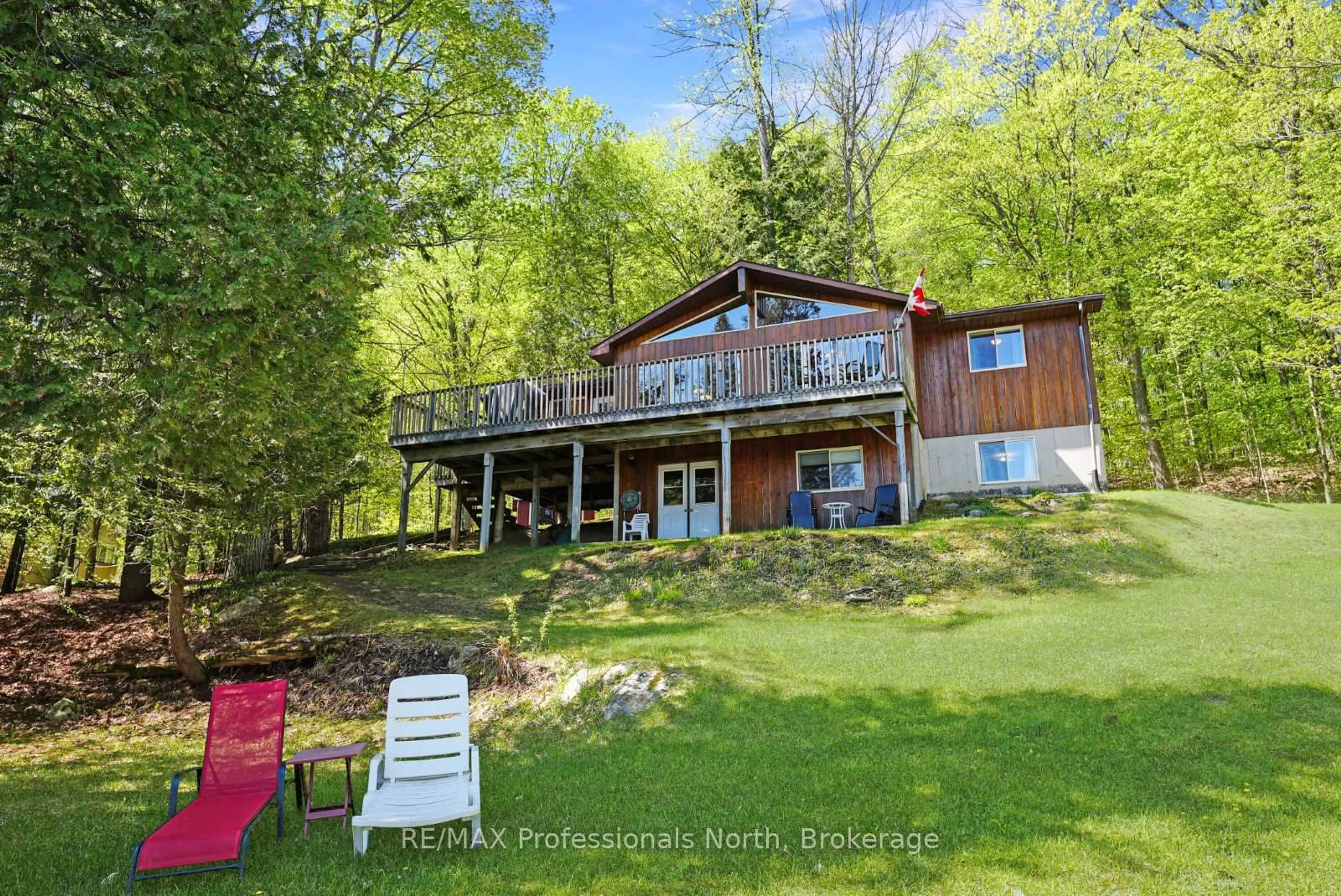 A pic from outside/outdoor area/front of a property/back of a property/a pic from drone, water/lake/river/ocean view for 1149 Harrison Bay Lane, Minden Hills Ontario K0M 2K0