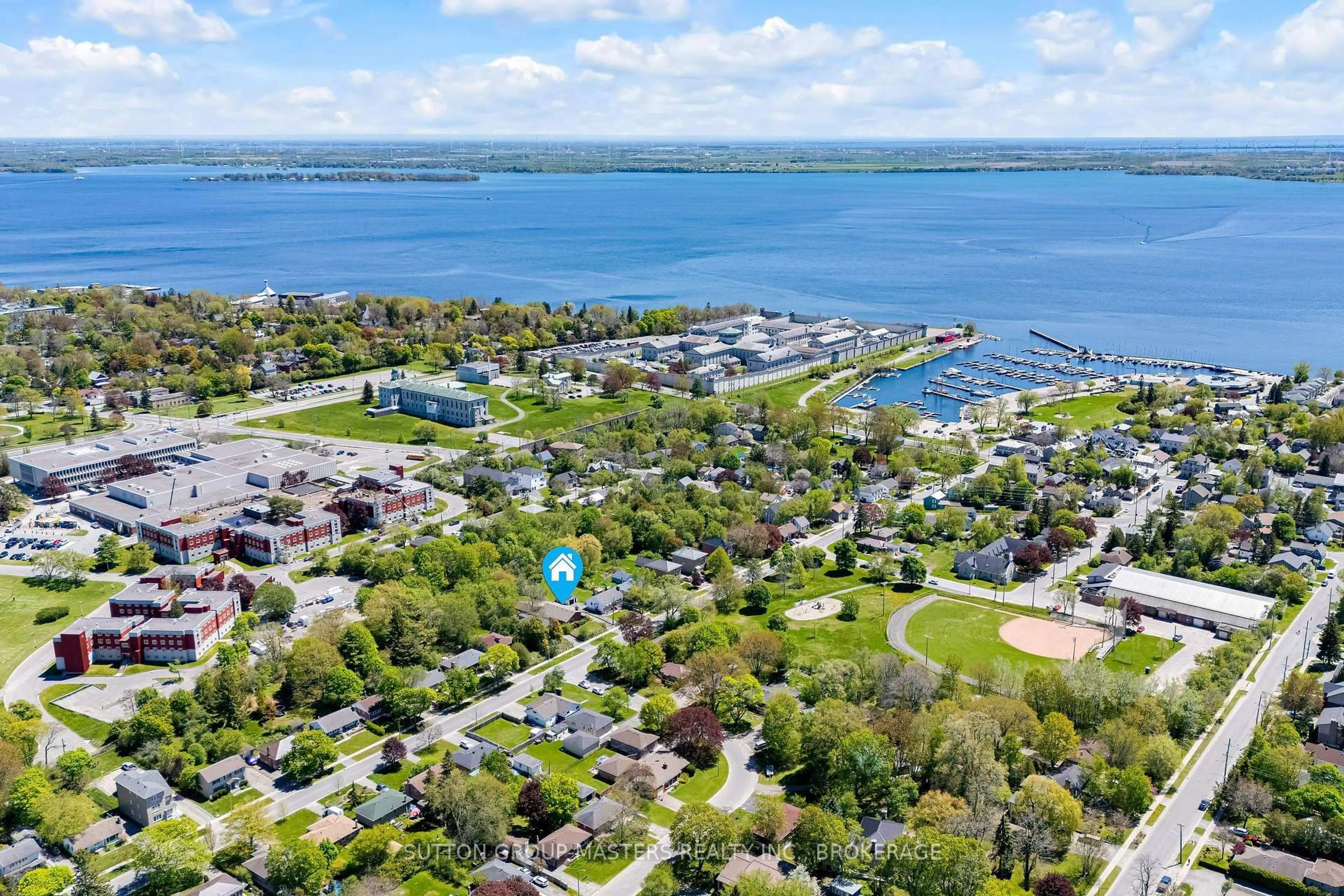 A pic from outside/outdoor area/front of a property/back of a property/a pic from drone, water/lake/river/ocean view for 215 Yonge St, Kingston Ontario K7M 1G2
