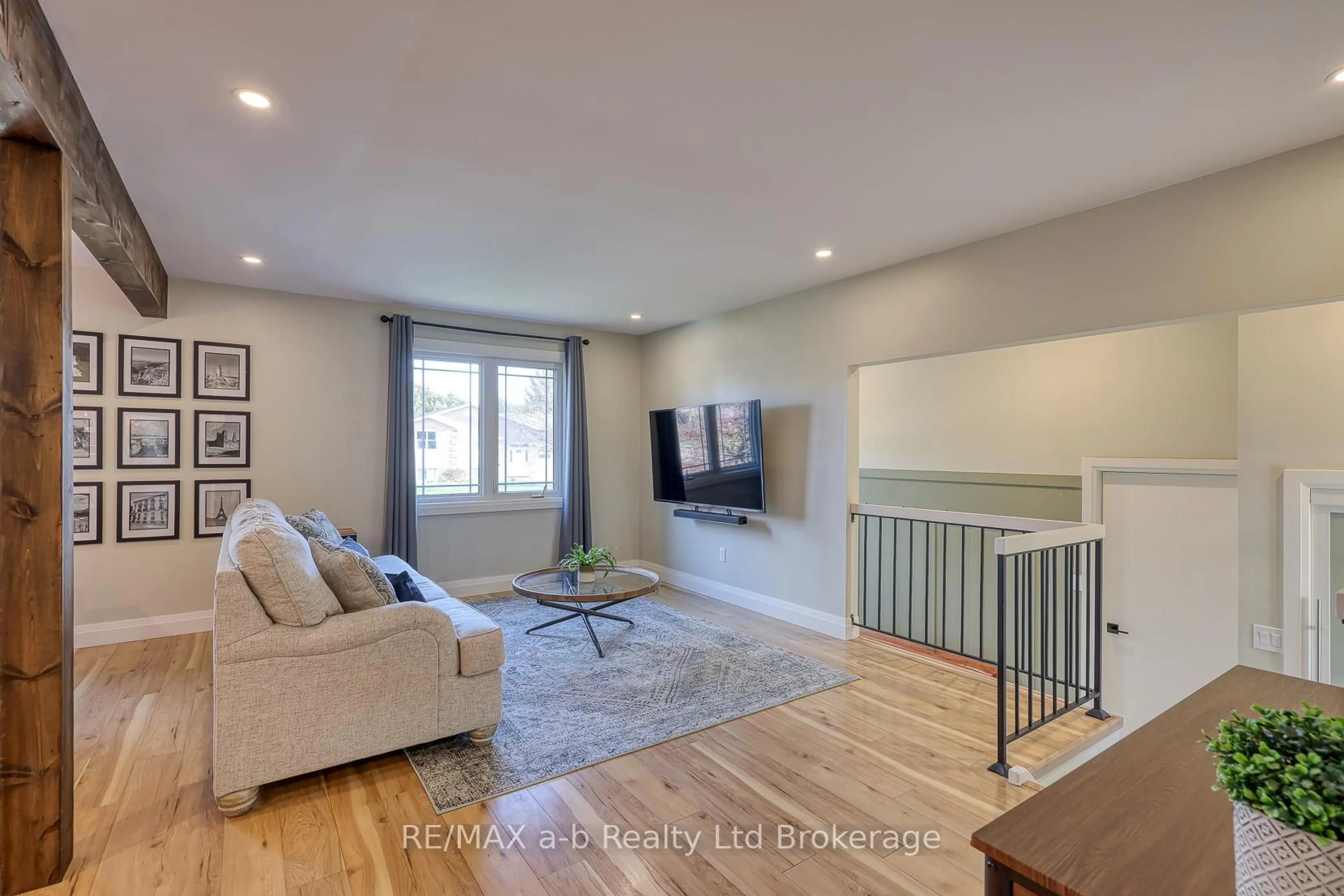 Living room with furniture, wood/laminate floor for 249 Arris Cres, West Perth Ontario N0K 1N0