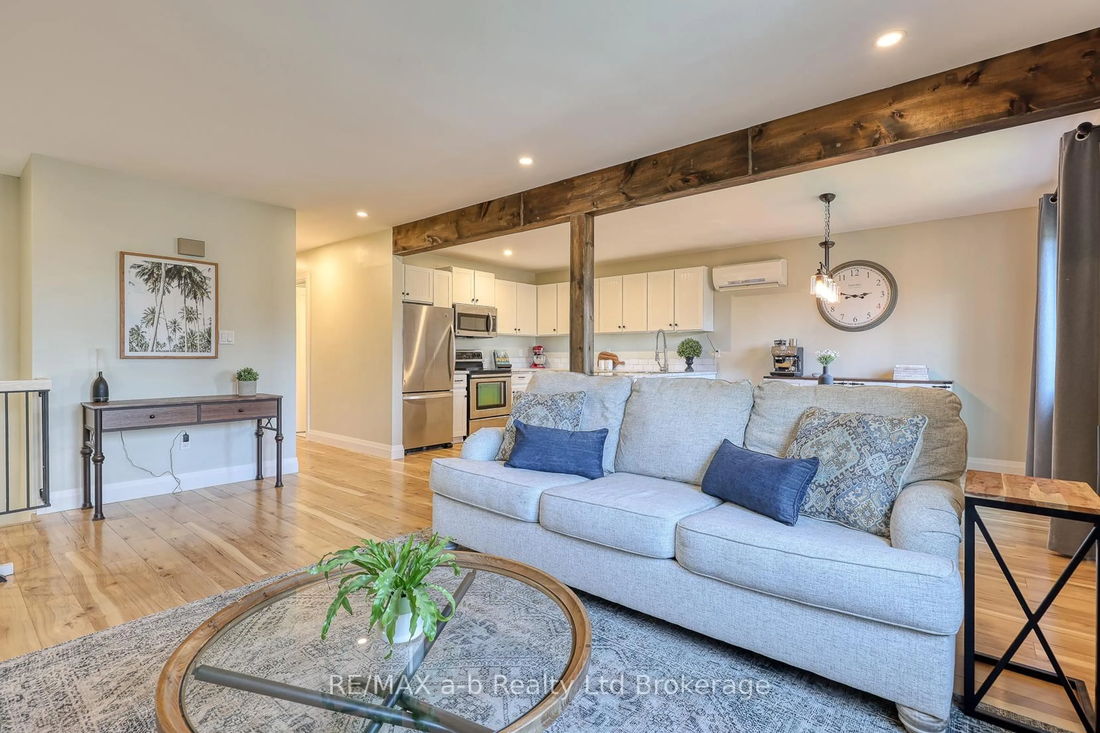 Living room with furniture, wood/laminate floor for 249 Arris Cres, West Perth Ontario N0K 1N0