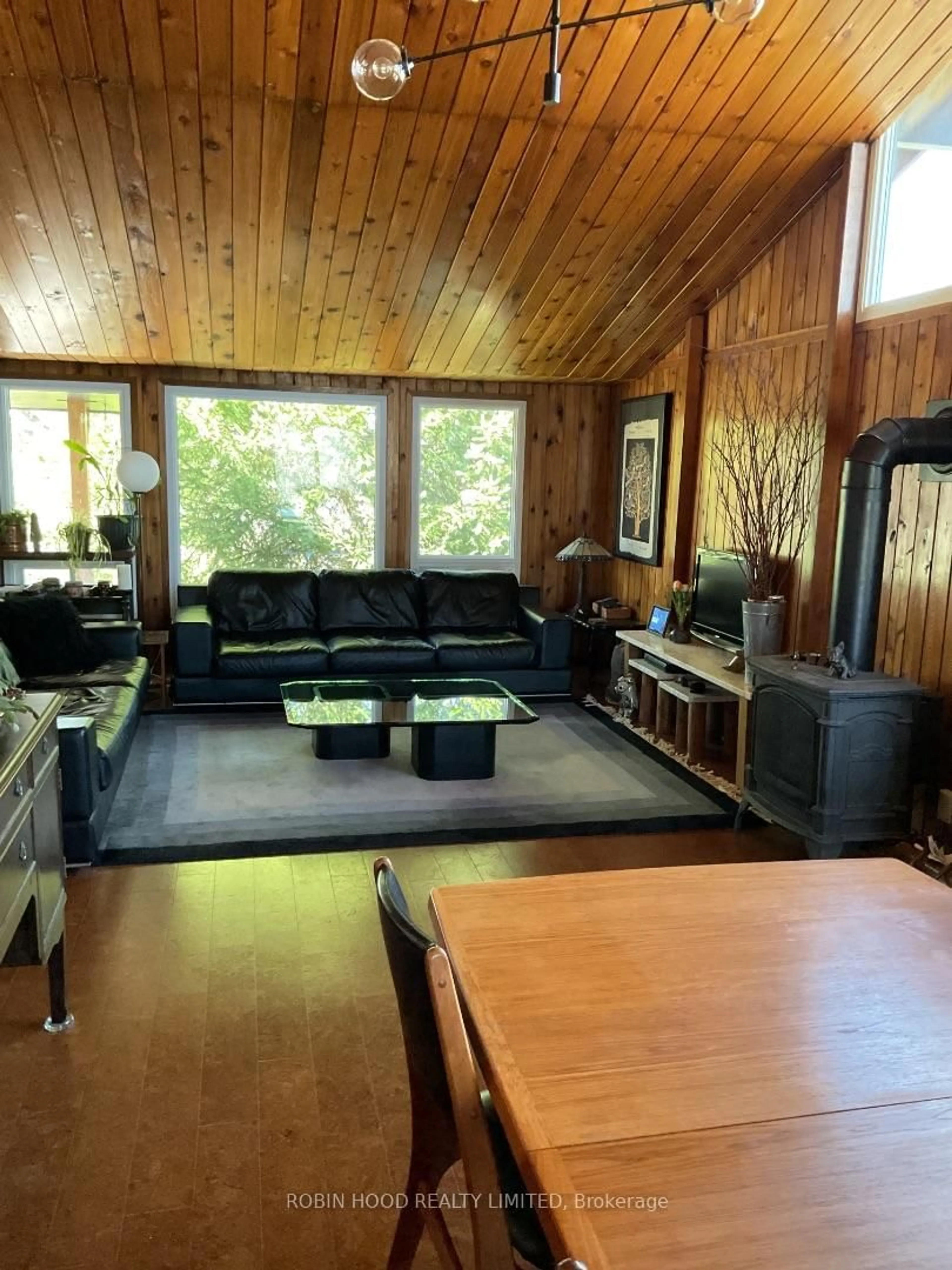 Living room with furniture, wood/laminate floor for 19 Tanner Rd, Trent Hills Ontario K0L 1L0