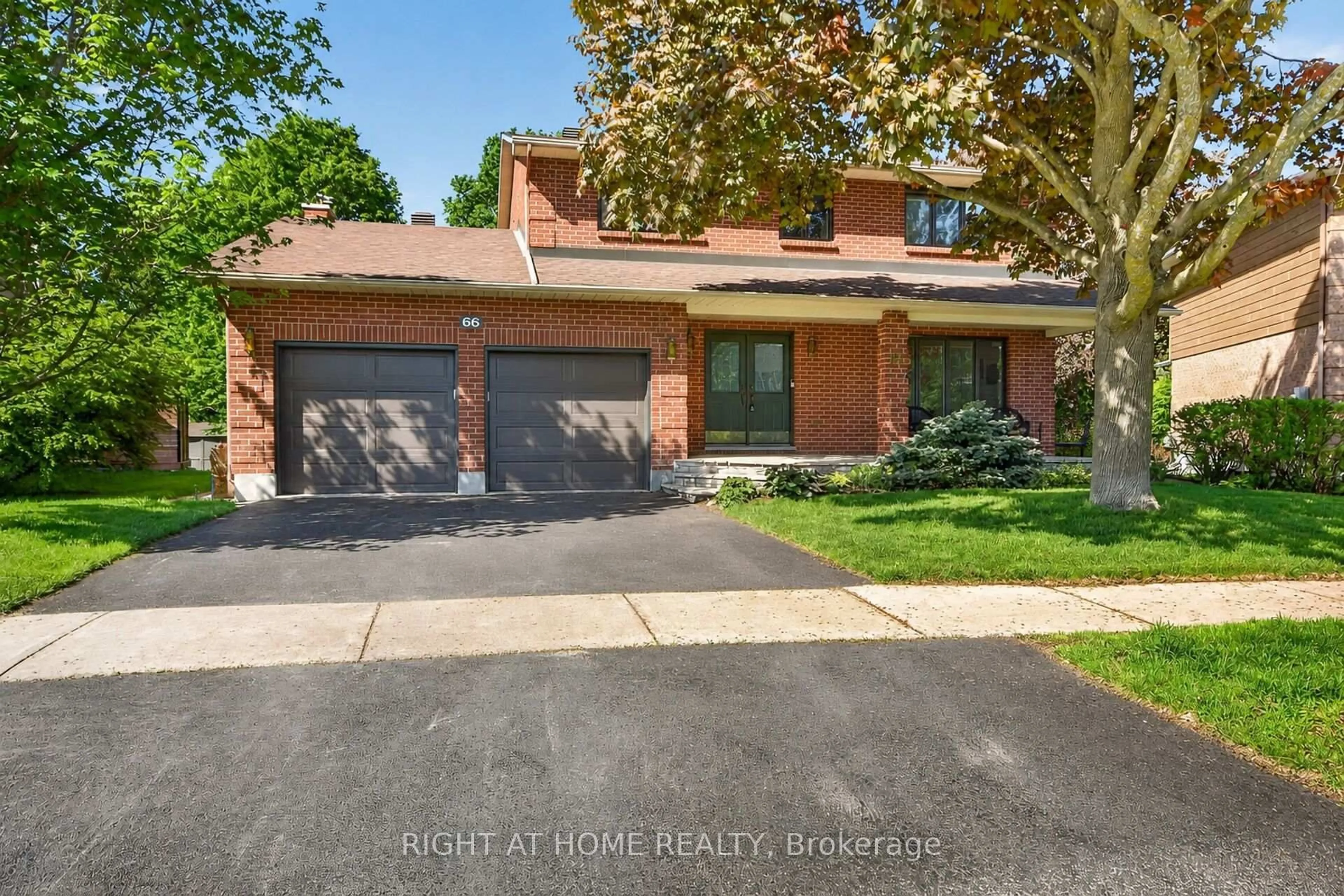 Home with brick exterior material, street for 66 Beechfern Dr, Stittsville Ontario K2S 1E3