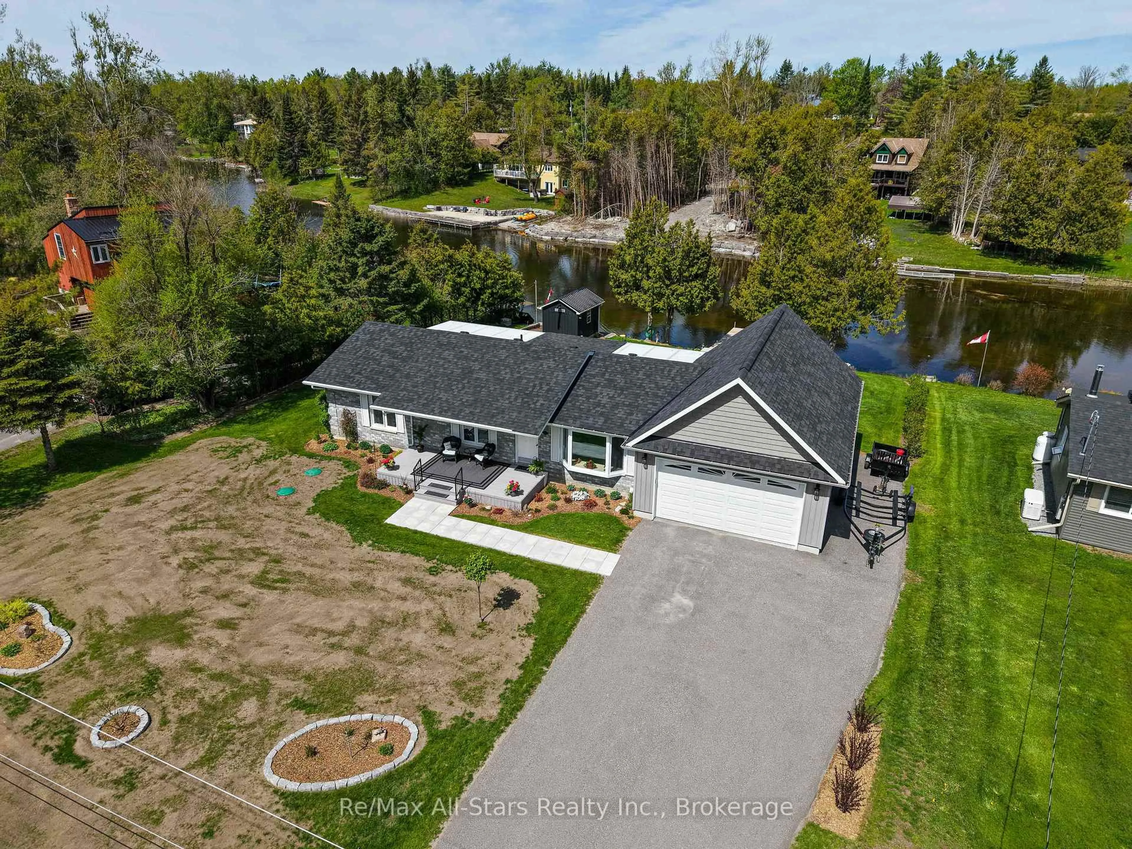 A pic from outside/outdoor area/front of a property/back of a property/a pic from drone, unknown for 113 Pirates Glen Dr, Trent Lakes Ontario K0M 1A0